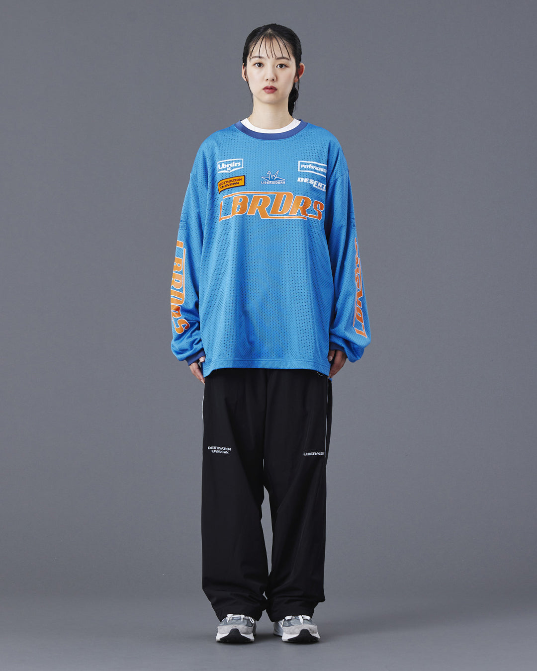 A Eckhaus Latta Shirt pictured on a model in front of a white background. The title of the product is Eckhaus Latta Eclipse Turtleneck - Stone and the image was taken by 199A®.