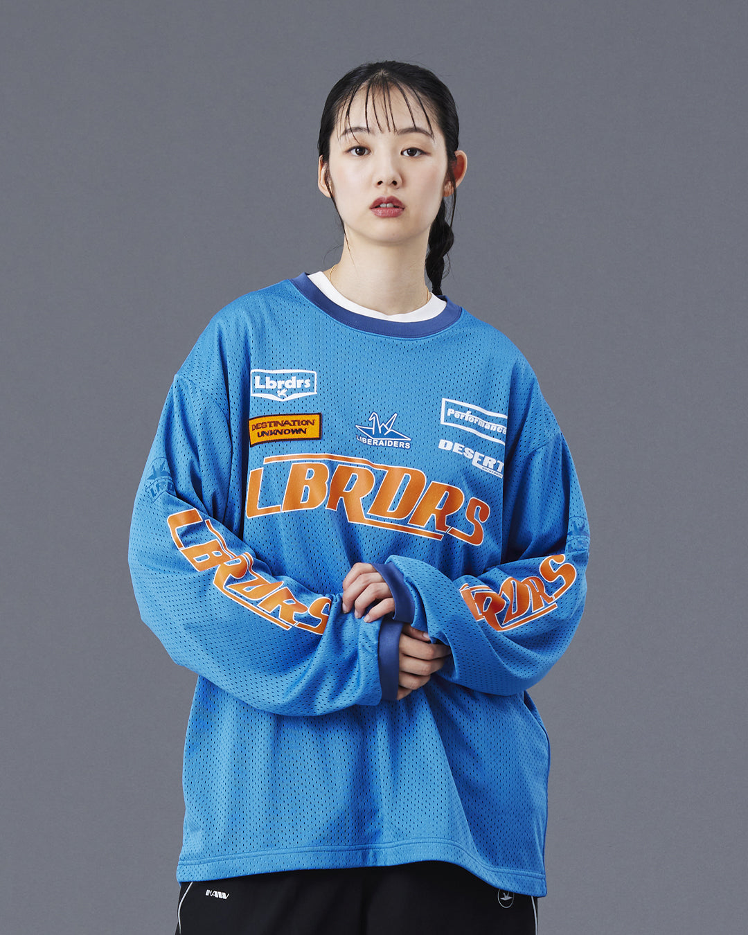 A Eckhaus Latta Shirt pictured on a model in front of a white background. The title of the product is Eckhaus Latta Eclipse Turtleneck - Stone and the image was taken by 199A®.