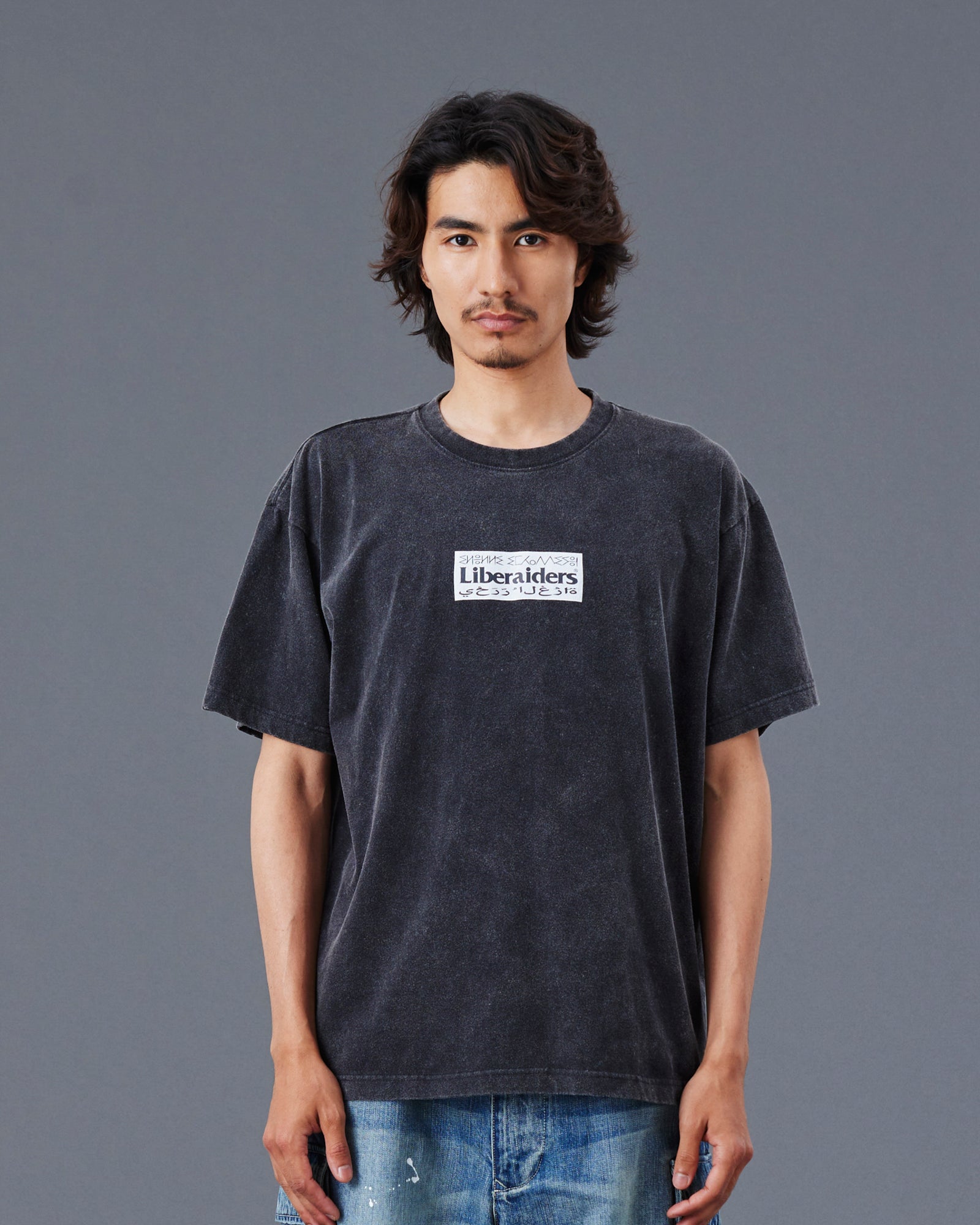 A Eckhaus Latta Shirt pictured on a model in front of a white background. The title of the product is Eckhaus Latta Eclipse Turtleneck - Stone and the image was taken by 199A®.