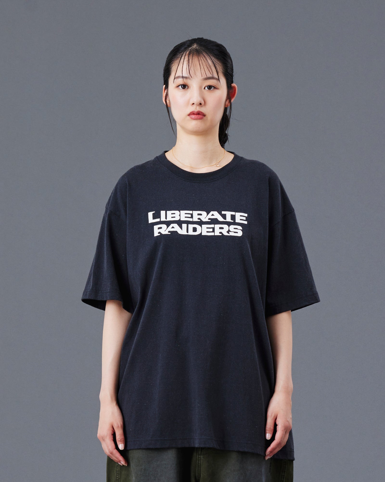 A Eckhaus Latta Shirt pictured on a model in front of a white background. The title of the product is Eckhaus Latta Eclipse Turtleneck - Stone and the image was taken by 199A®.