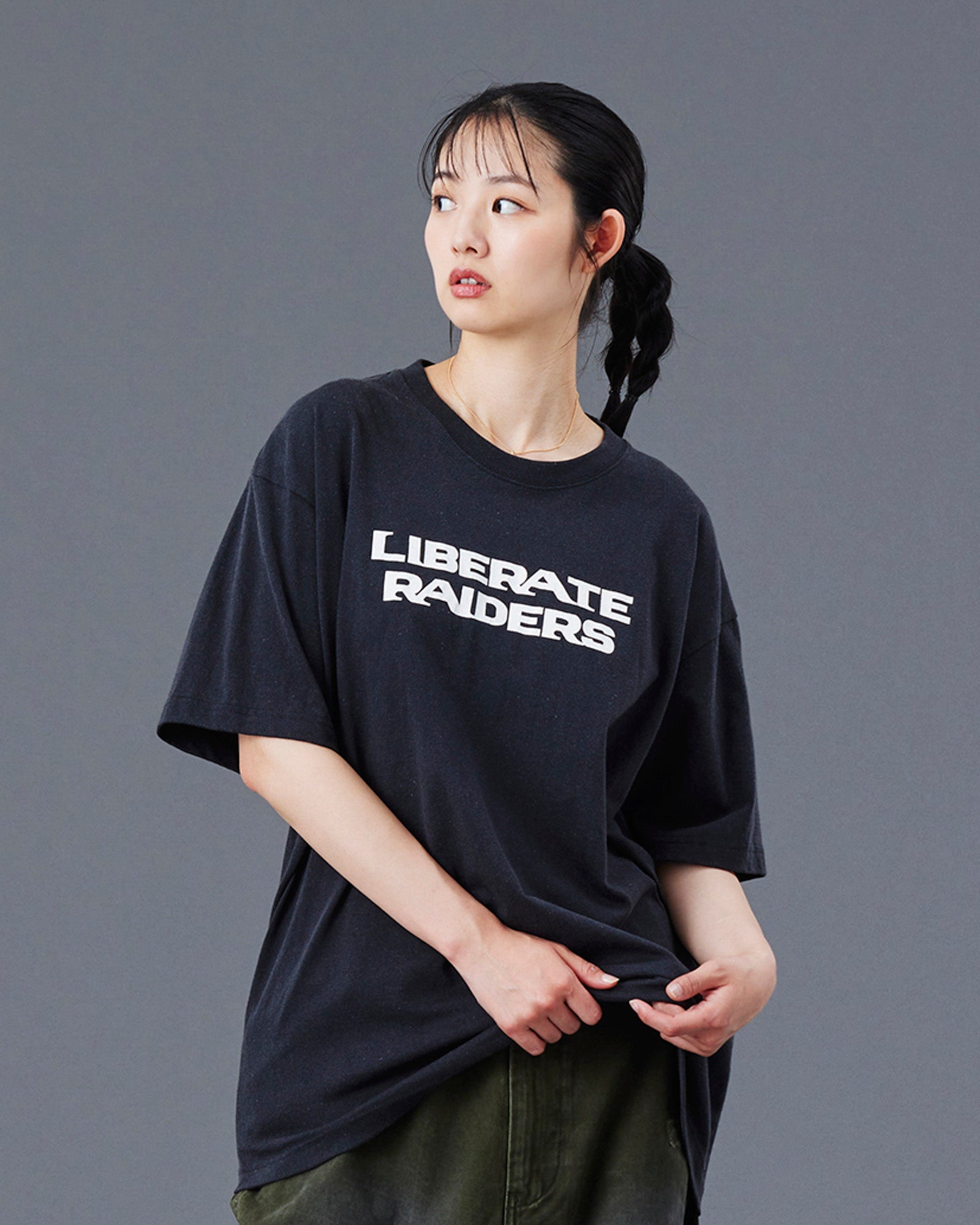 A Eckhaus Latta Shirt pictured on a model in front of a white background. The title of the product is Eckhaus Latta Eclipse Turtleneck - Stone and the image was taken by 199A®.