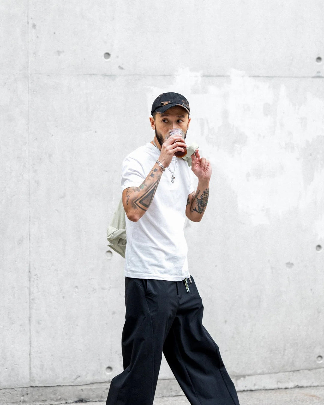 A Eckhaus Latta Shirt pictured on a model in front of a white background. The title of the product is Eckhaus Latta Eclipse Turtleneck - Stone and the image was taken by 199A®.