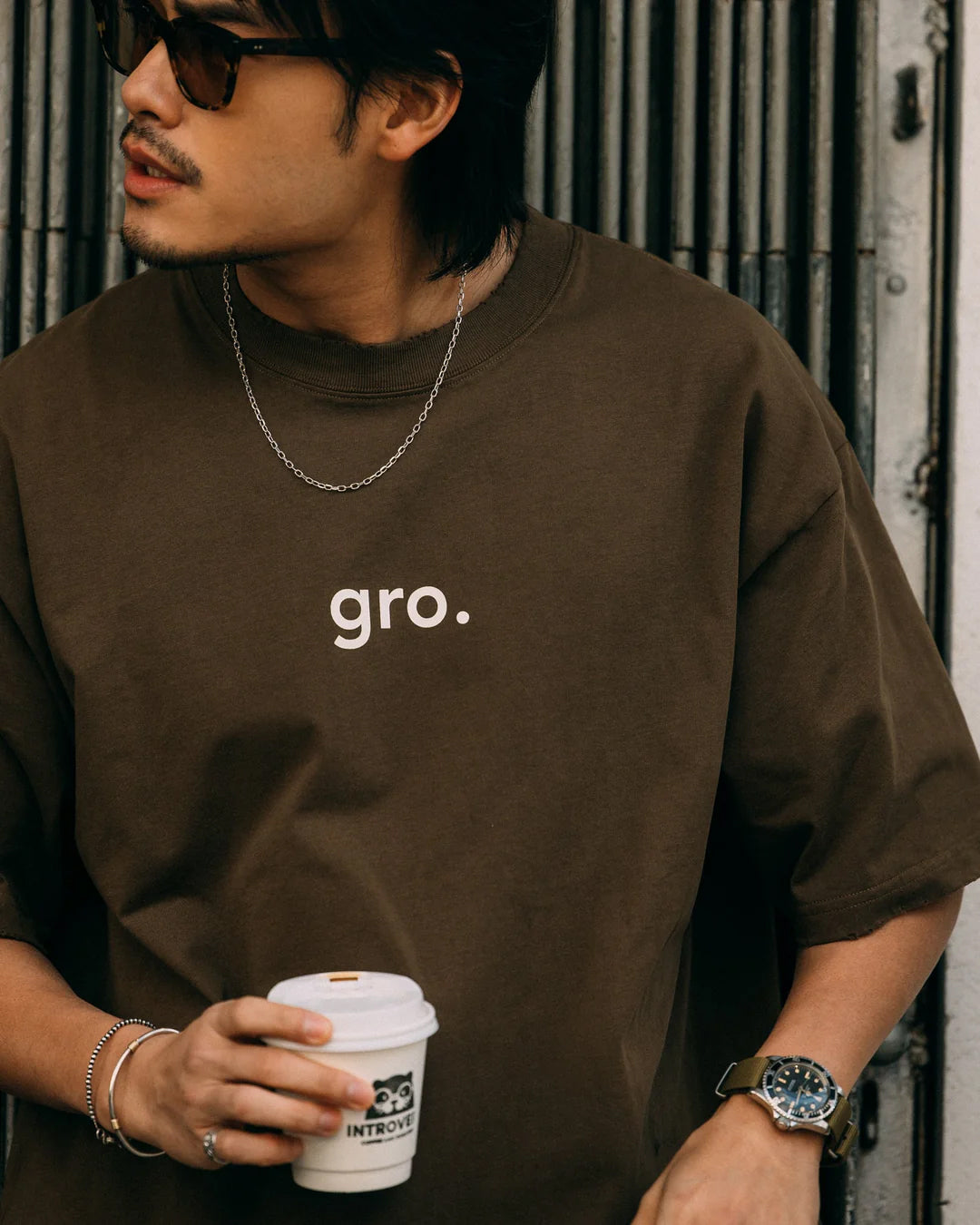 A Eckhaus Latta Shirt pictured on a model in front of a white background. The title of the product is Eckhaus Latta Eclipse Turtleneck - Stone and the image was taken by 199A®.