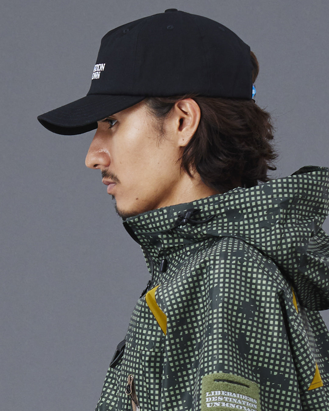 A Eckhaus Latta Shirt pictured on a model in front of a white background. The title of the product is Eckhaus Latta Eclipse Turtleneck - Stone and the image was taken by 199A®.