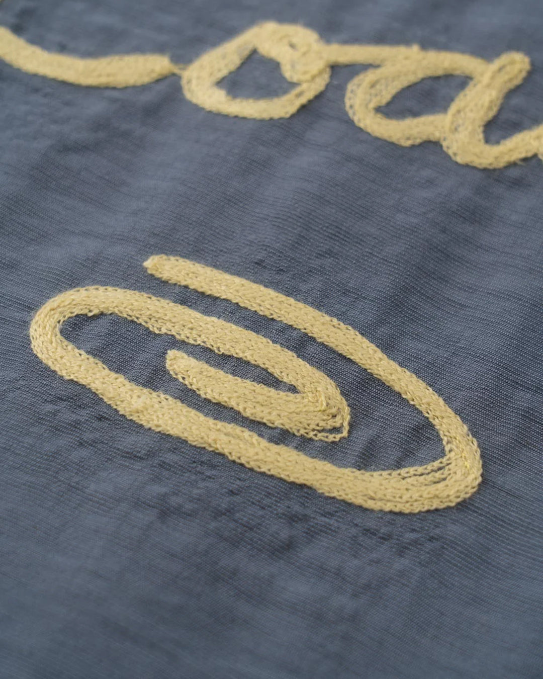 A Eckhaus Latta Shirt pictured on a model in front of a white background. The title of the product is Eckhaus Latta Eclipse Turtleneck - Stone and the image was taken by 199A®.