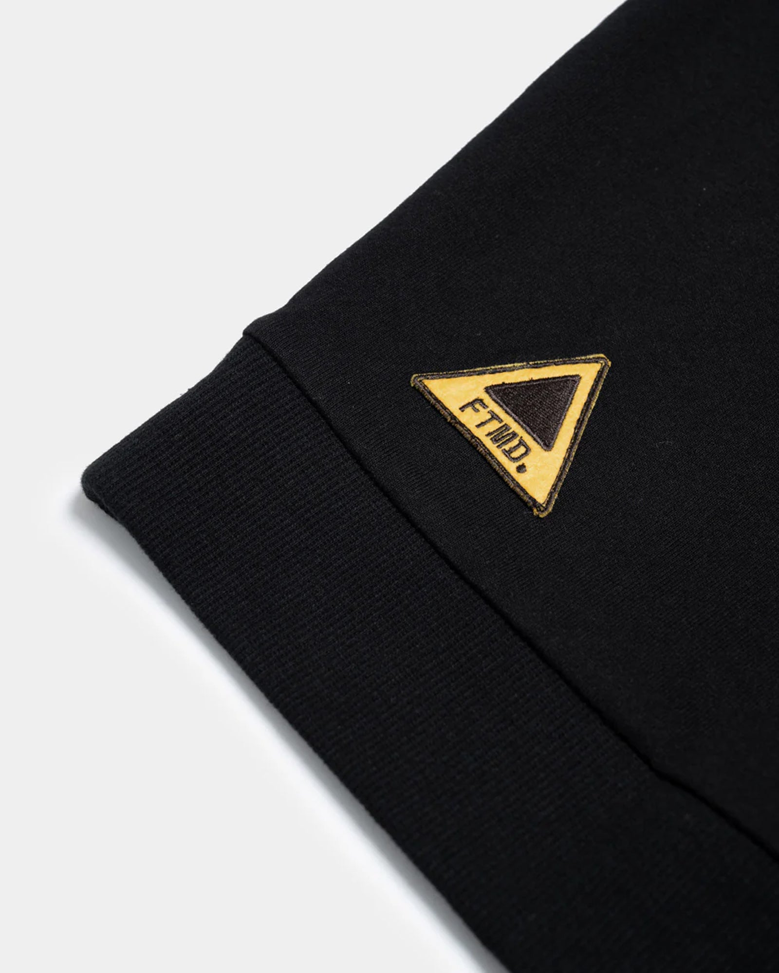 A Eckhaus Latta Shirt pictured on a model in front of a white background. The title of the product is Eckhaus Latta Eclipse Turtleneck - Stone and the image was taken by 199A®.