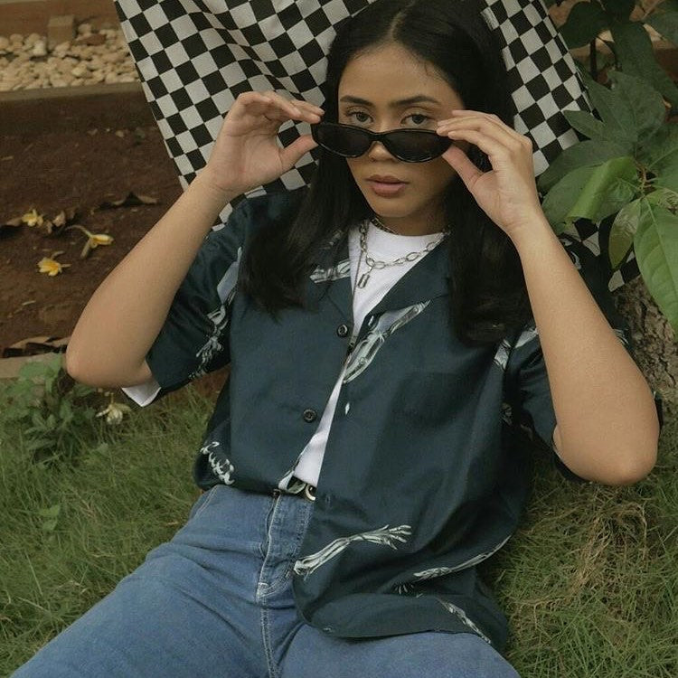 A Eckhaus Latta Shirt pictured on a model in front of a white background. The title of the product is Eckhaus Latta Eclipse Turtleneck - Stone and the image was taken by 199A®.