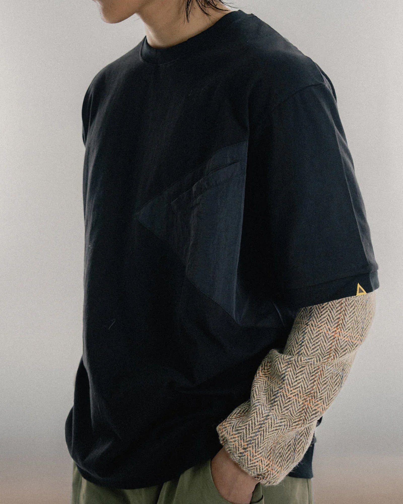 A Eckhaus Latta Shirt pictured on a model in front of a white background. The title of the product is Eckhaus Latta Eclipse Turtleneck - Stone and the image was taken by 199A®.