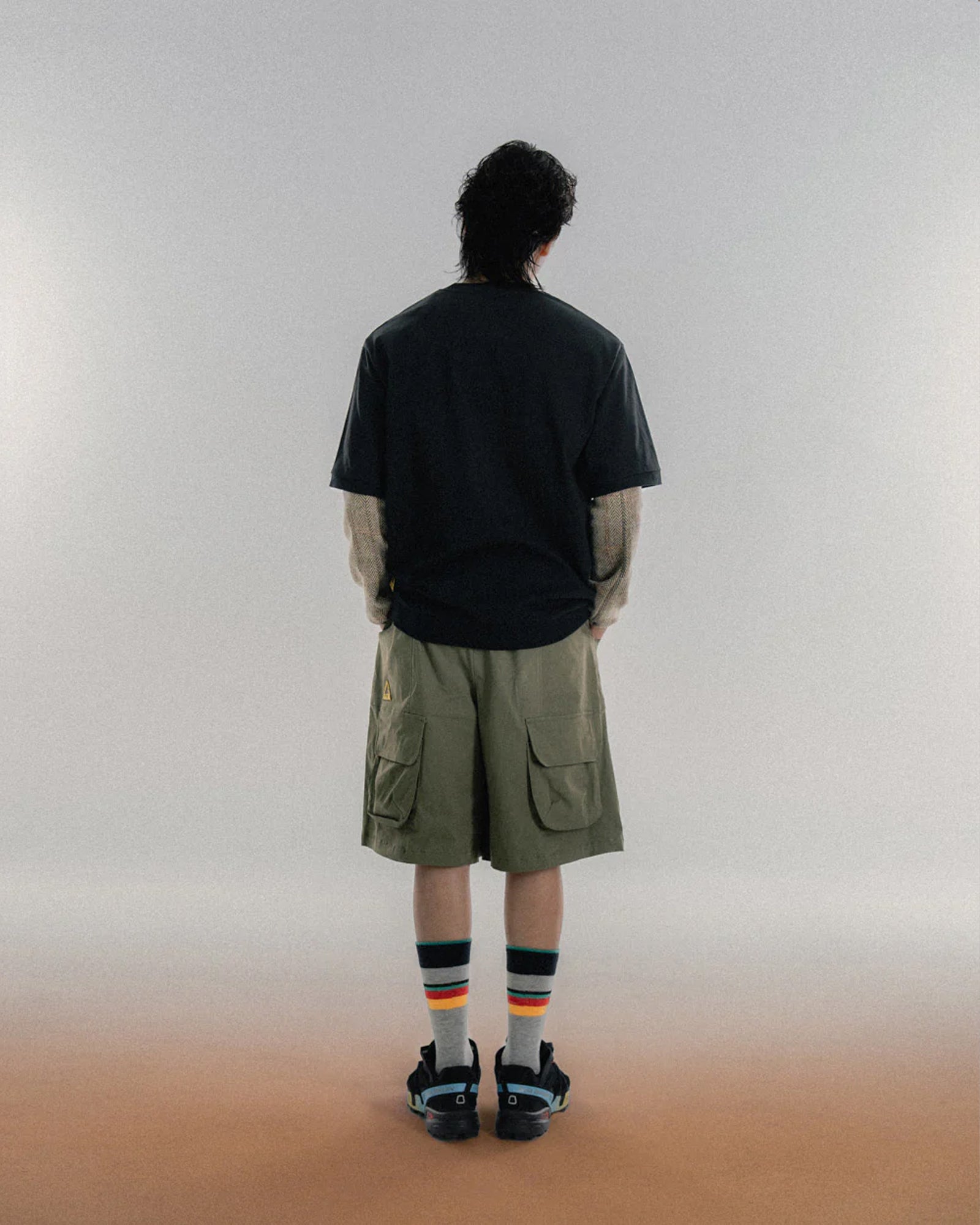 A Eckhaus Latta Shirt pictured on a model in front of a white background. The title of the product is Eckhaus Latta Eclipse Turtleneck - Stone and the image was taken by 199A®.