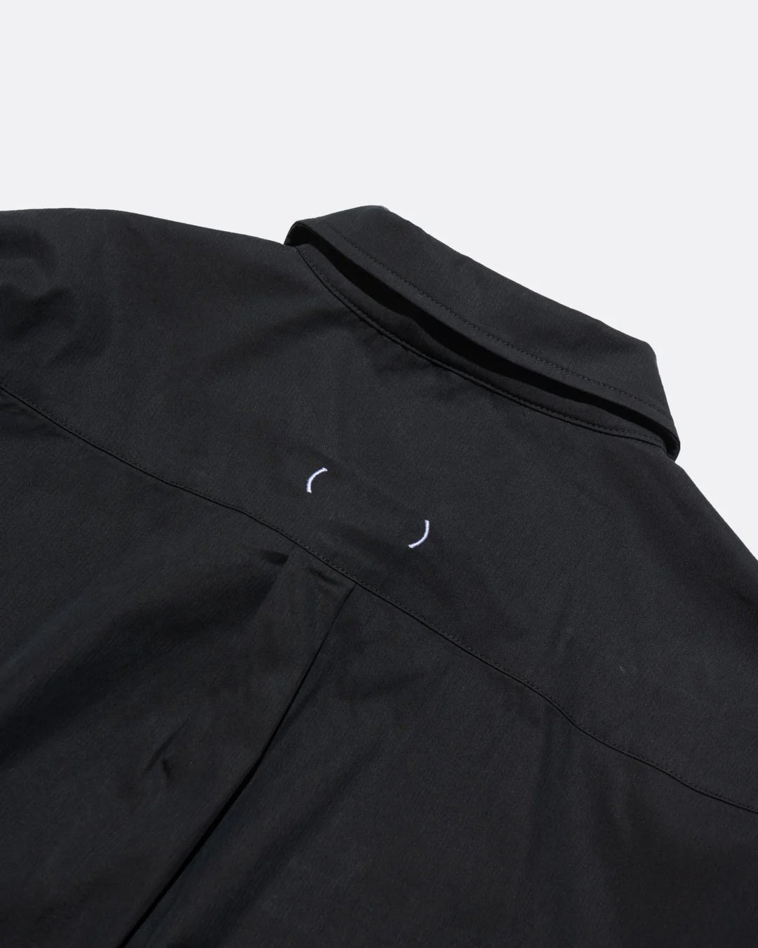 A Eckhaus Latta Shirt pictured on a model in front of a white background. The title of the product is Eckhaus Latta Eclipse Turtleneck - Stone and the image was taken by 199A®.