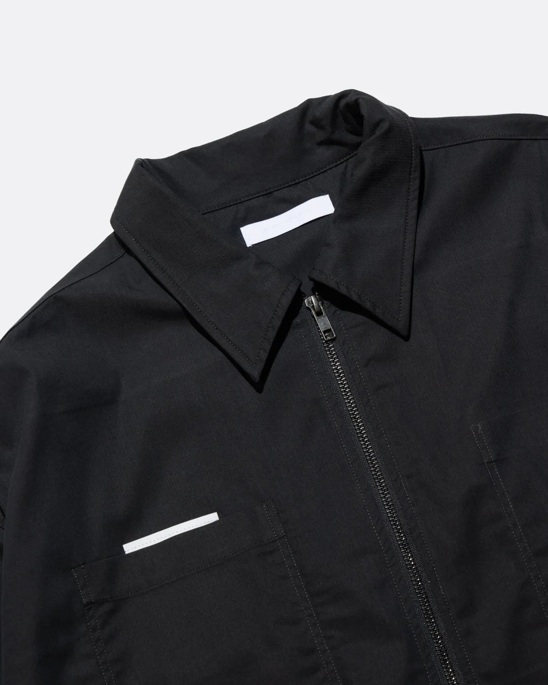 A Eckhaus Latta Shirt pictured on a model in front of a white background. The title of the product is Eckhaus Latta Eclipse Turtleneck - Stone and the image was taken by 199A®.