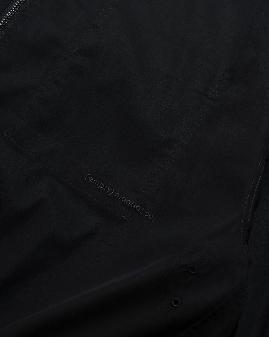 A Eckhaus Latta Shirt pictured on a model in front of a white background. The title of the product is Eckhaus Latta Eclipse Turtleneck - Stone and the image was taken by 199A®.