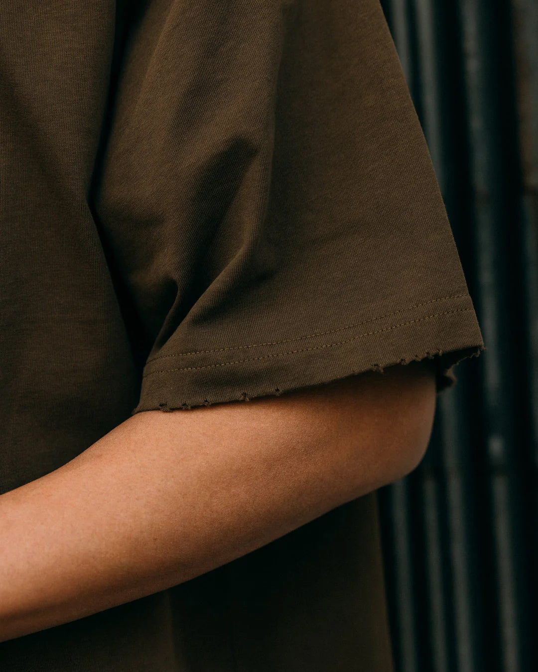 A Eckhaus Latta Shirt pictured on a model in front of a white background. The title of the product is Eckhaus Latta Eclipse Turtleneck - Stone and the image was taken by 199A®.