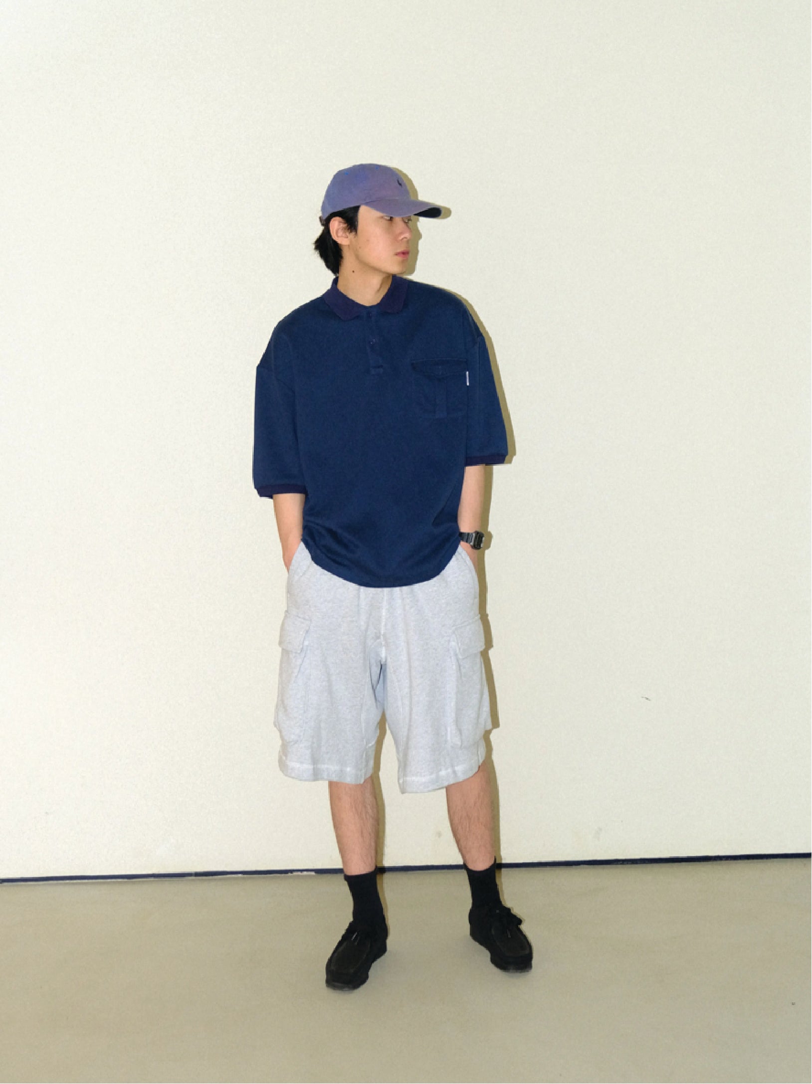 A Eckhaus Latta Shirt pictured on a model in front of a white background. The title of the product is Eckhaus Latta Eclipse Turtleneck - Stone and the image was taken by 199A®.