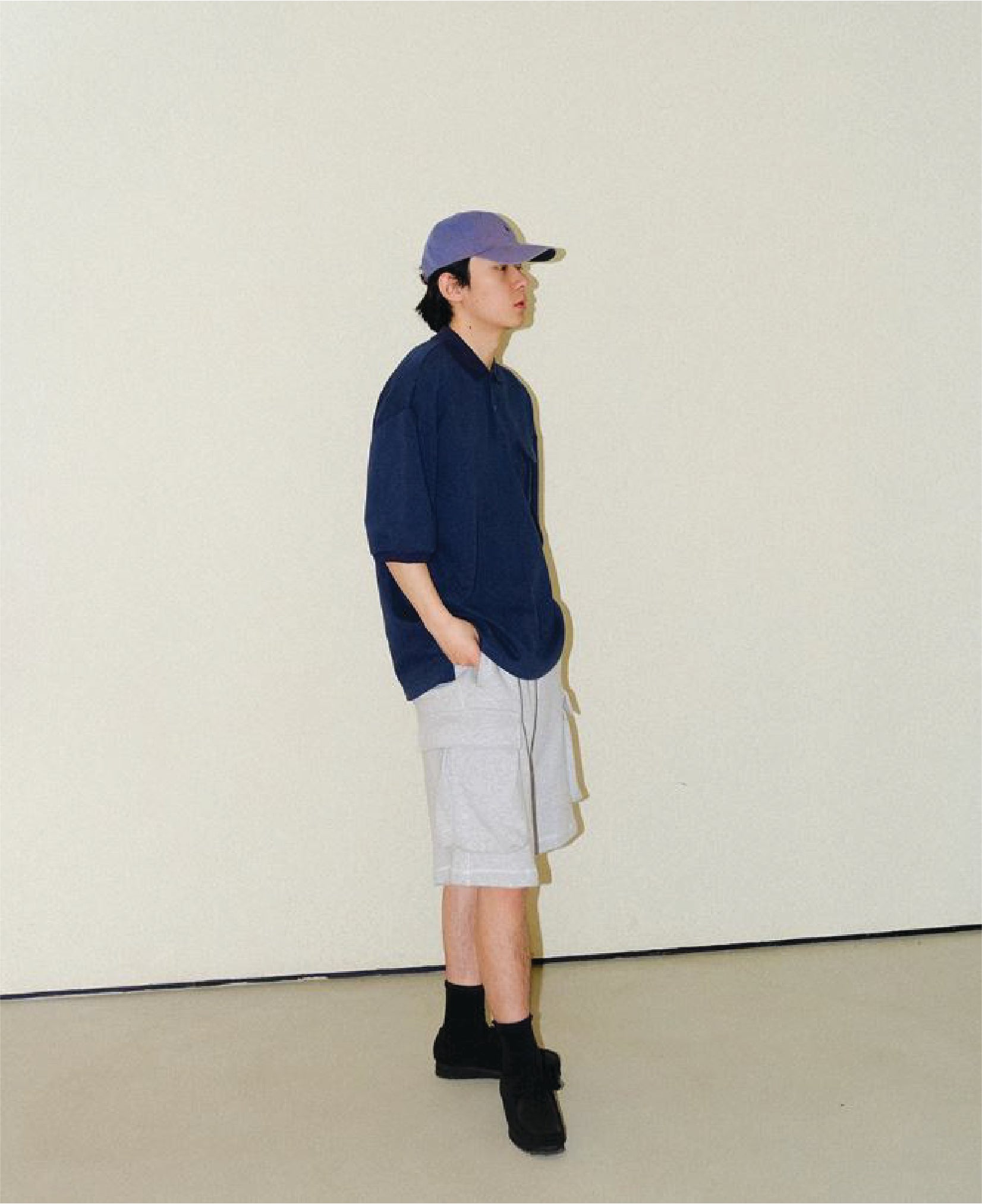 A Eckhaus Latta Shirt pictured on a model in front of a white background. The title of the product is Eckhaus Latta Eclipse Turtleneck - Stone and the image was taken by 199A®.