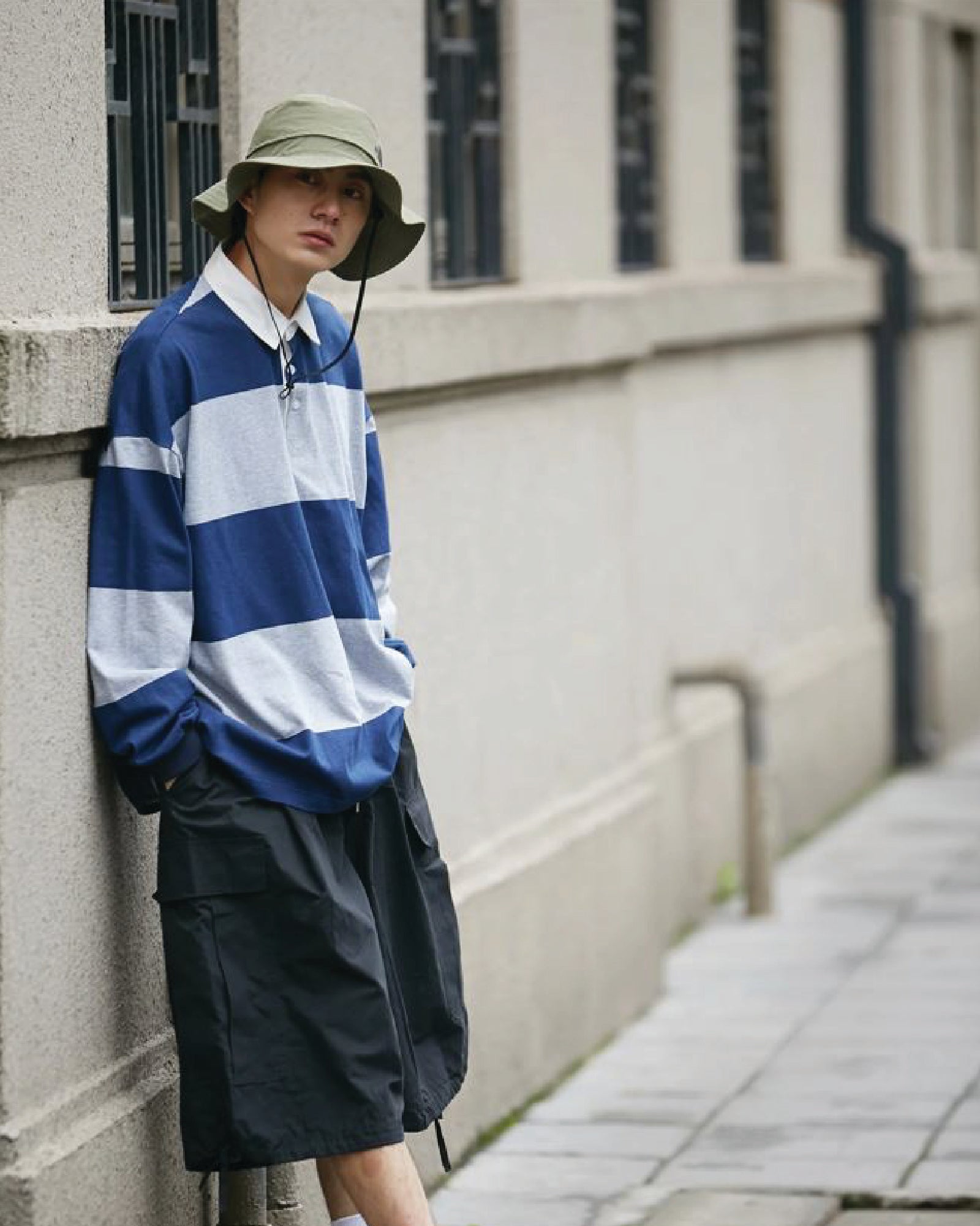 A Eckhaus Latta Shirt pictured on a model in front of a white background. The title of the product is Eckhaus Latta Eclipse Turtleneck - Stone and the image was taken by 199A®.