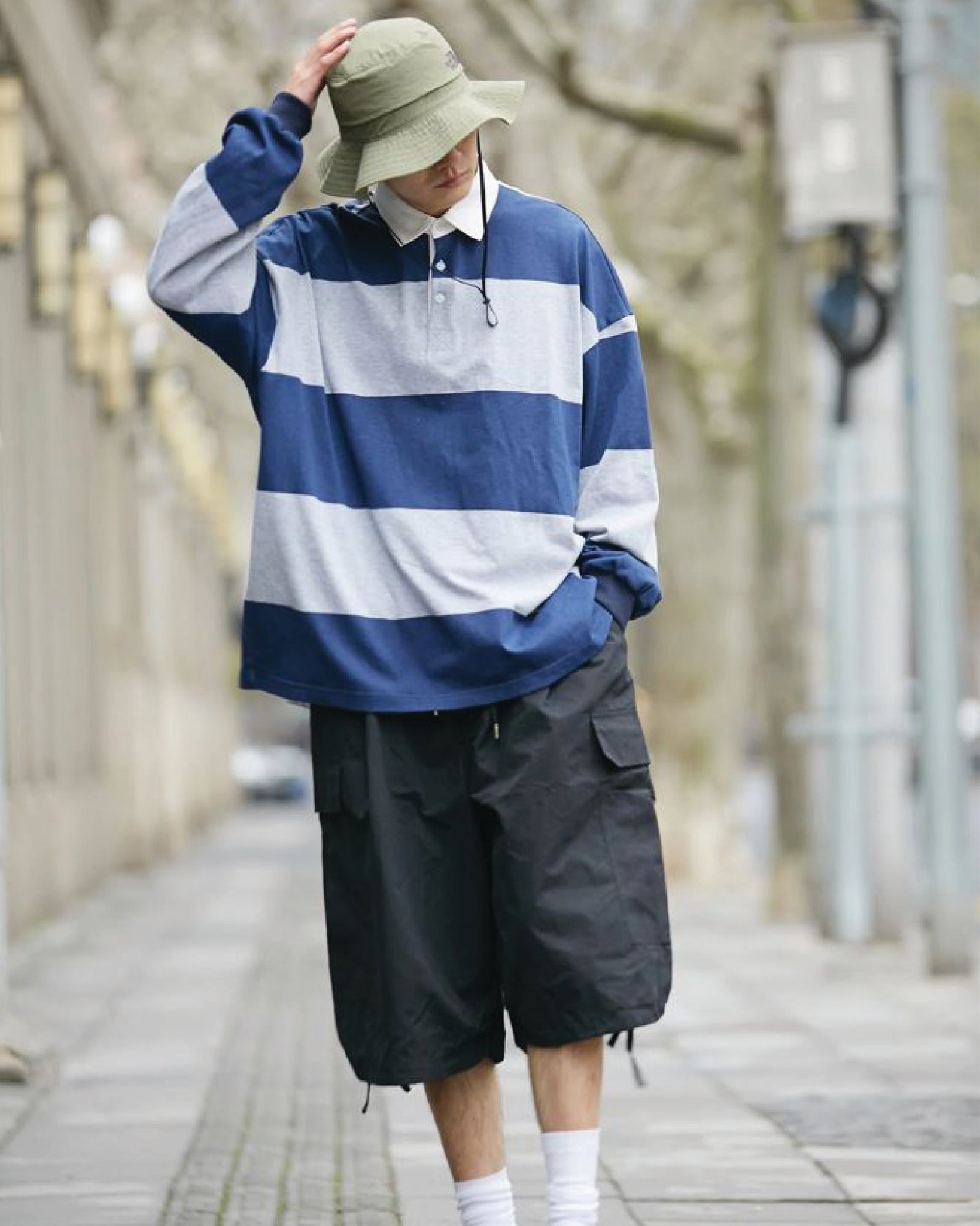 A Eckhaus Latta Shirt pictured on a model in front of a white background. The title of the product is Eckhaus Latta Eclipse Turtleneck - Stone and the image was taken by 199A®.