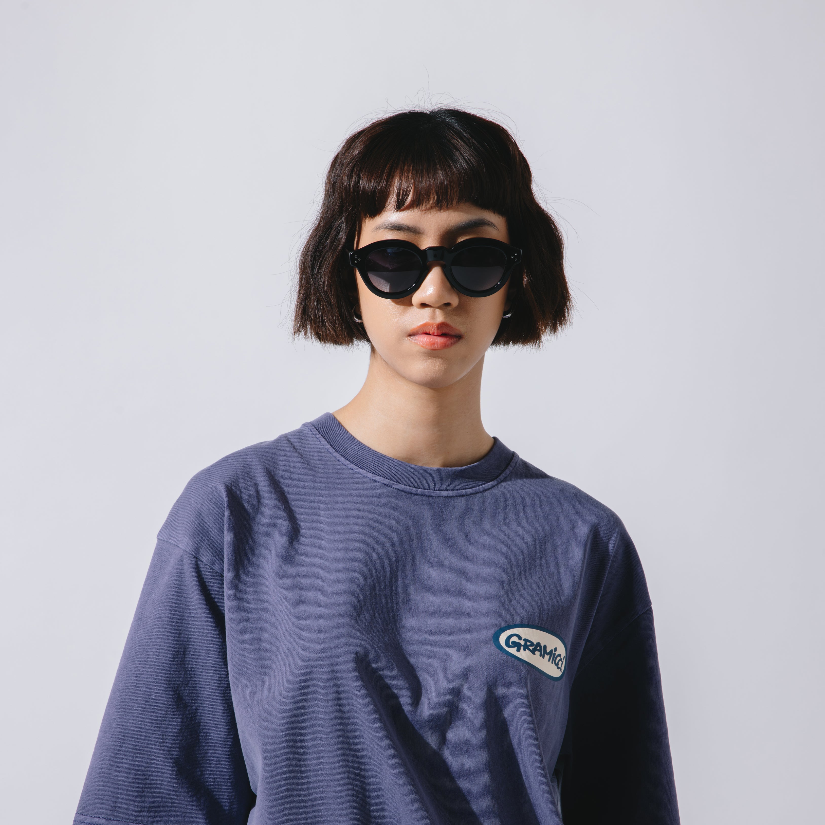 A Eckhaus Latta Shirt pictured on a model in front of a white background. The title of the product is Eckhaus Latta Eclipse Turtleneck - Stone and the image was taken by 199A®.