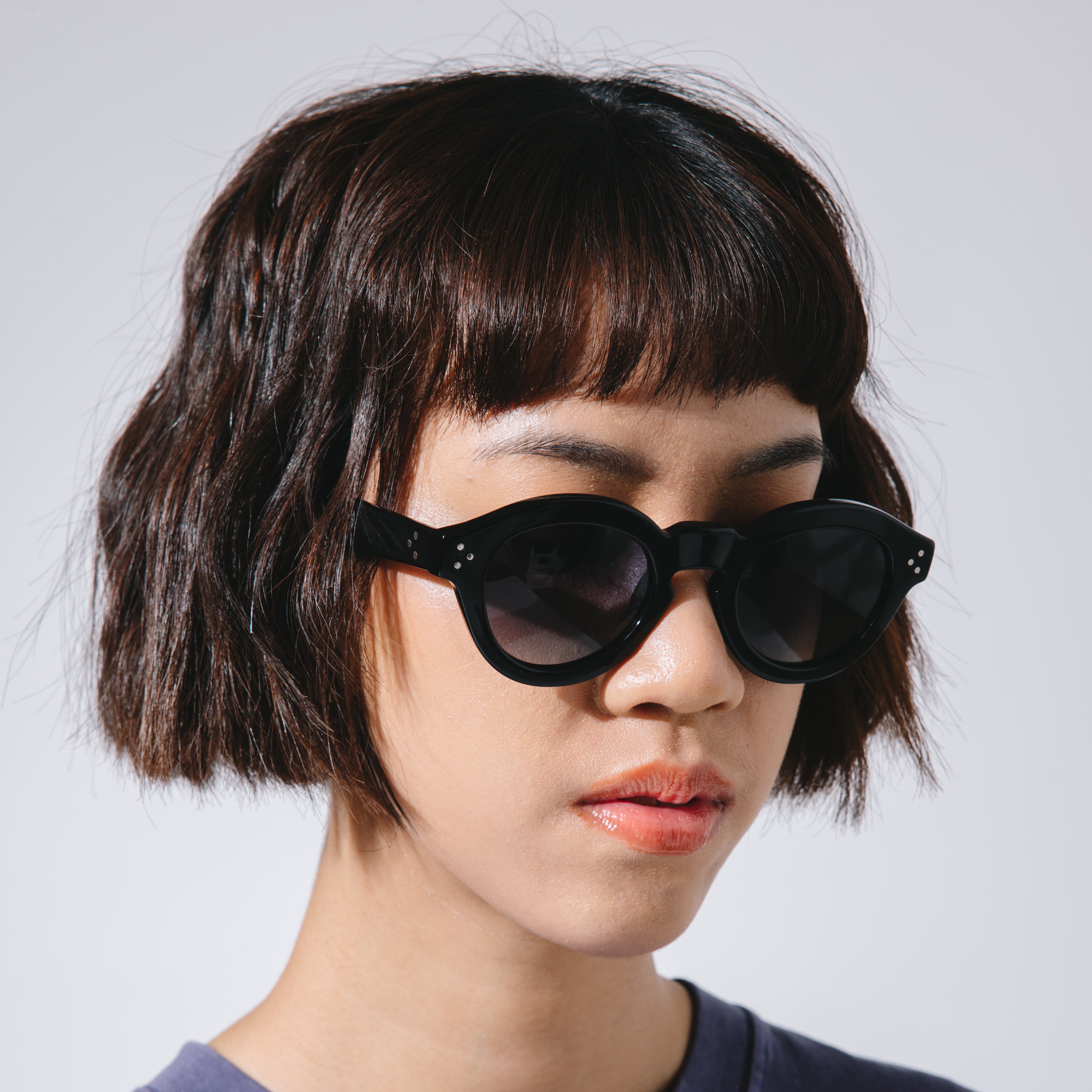 A Eckhaus Latta Shirt pictured on a model in front of a white background. The title of the product is Eckhaus Latta Eclipse Turtleneck - Stone and the image was taken by 199A®.