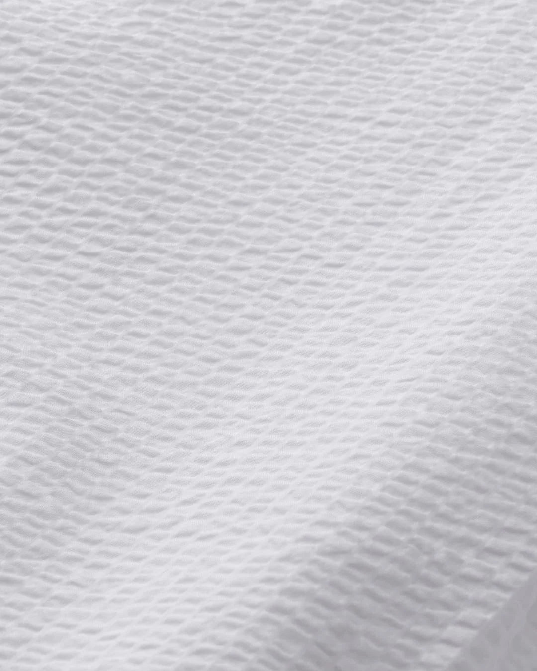A Eckhaus Latta Shirt pictured on a model in front of a white background. The title of the product is Eckhaus Latta Eclipse Turtleneck - Stone and the image was taken by 199A®.