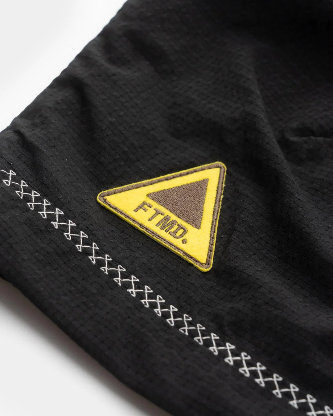 A Eckhaus Latta Shirt pictured on a model in front of a white background. The title of the product is Eckhaus Latta Eclipse Turtleneck - Stone and the image was taken by 199A®.