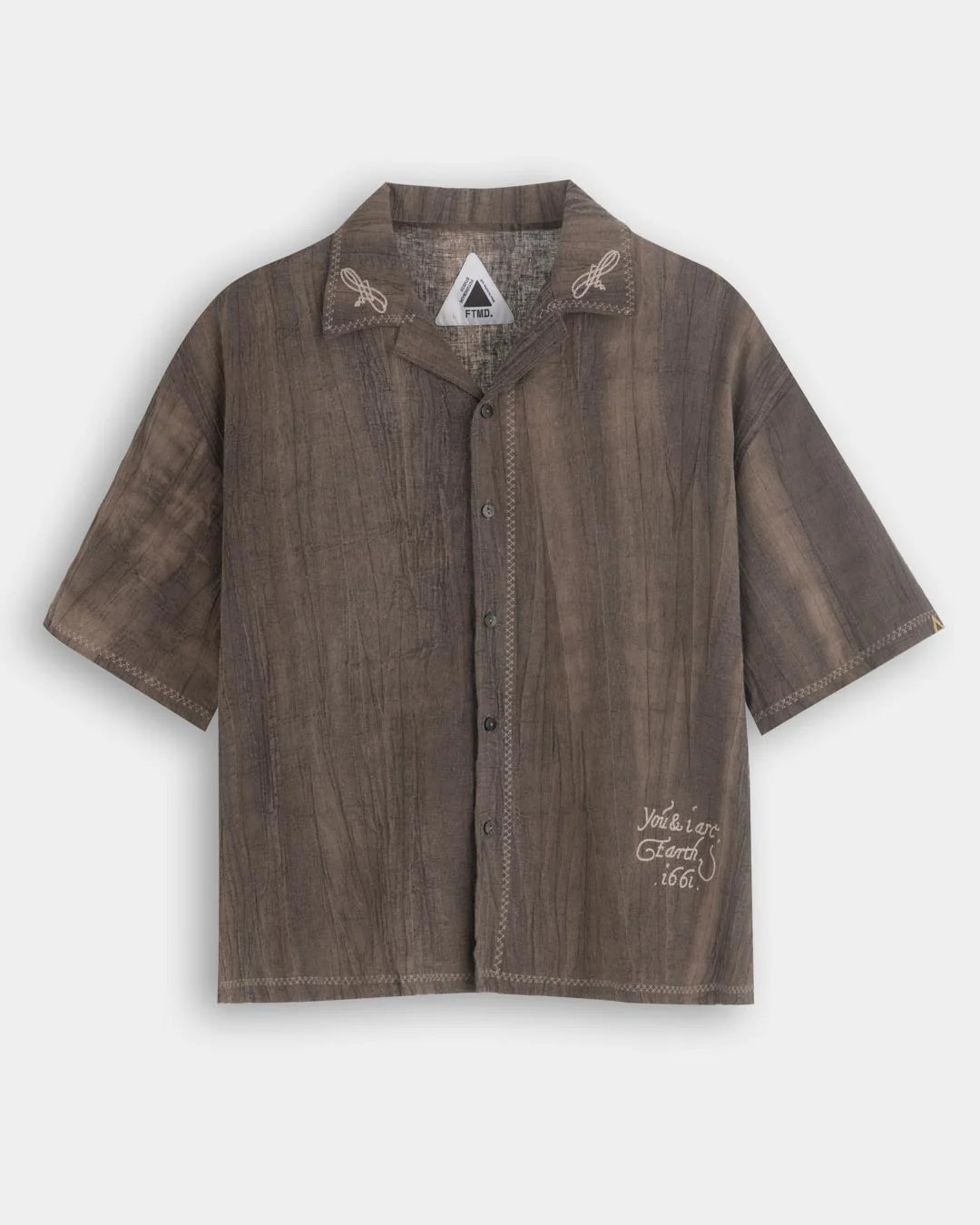 A Eckhaus Latta Shirt pictured on a model in front of a white background. The title of the product is Eckhaus Latta Eclipse Turtleneck - Stone and the image was taken by 199A®.