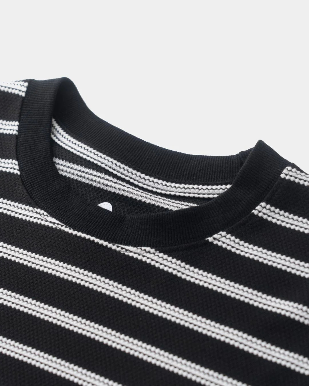 A Eckhaus Latta Shirt pictured on a model in front of a white background. The title of the product is Eckhaus Latta Eclipse Turtleneck - Stone and the image was taken by 199A®.