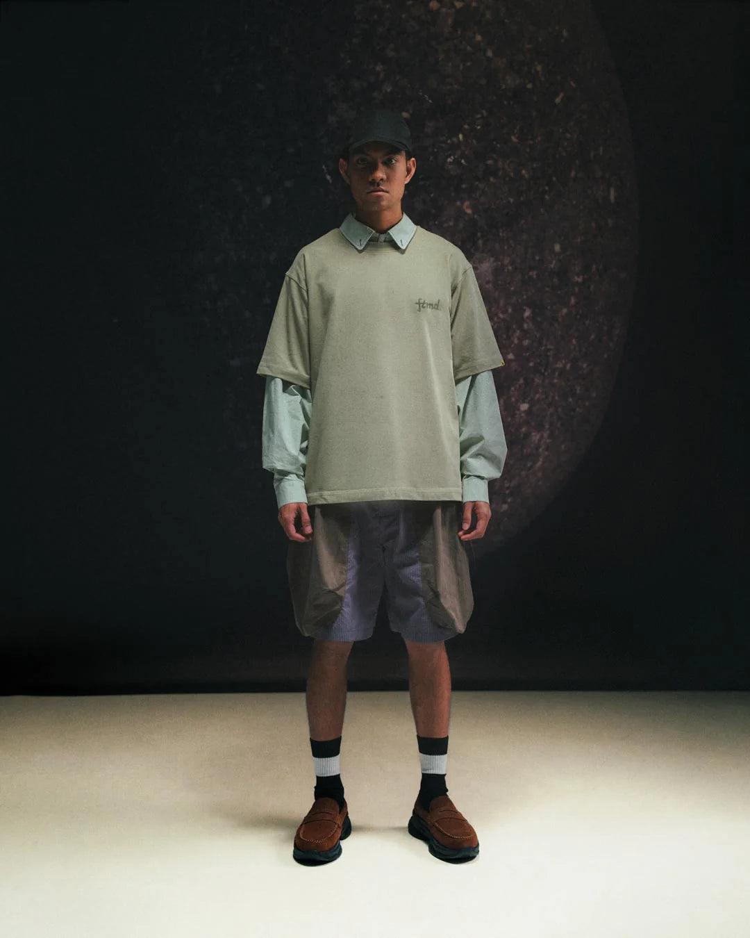 A Eckhaus Latta Shirt pictured on a model in front of a white background. The title of the product is Eckhaus Latta Eclipse Turtleneck - Stone and the image was taken by 199A®.