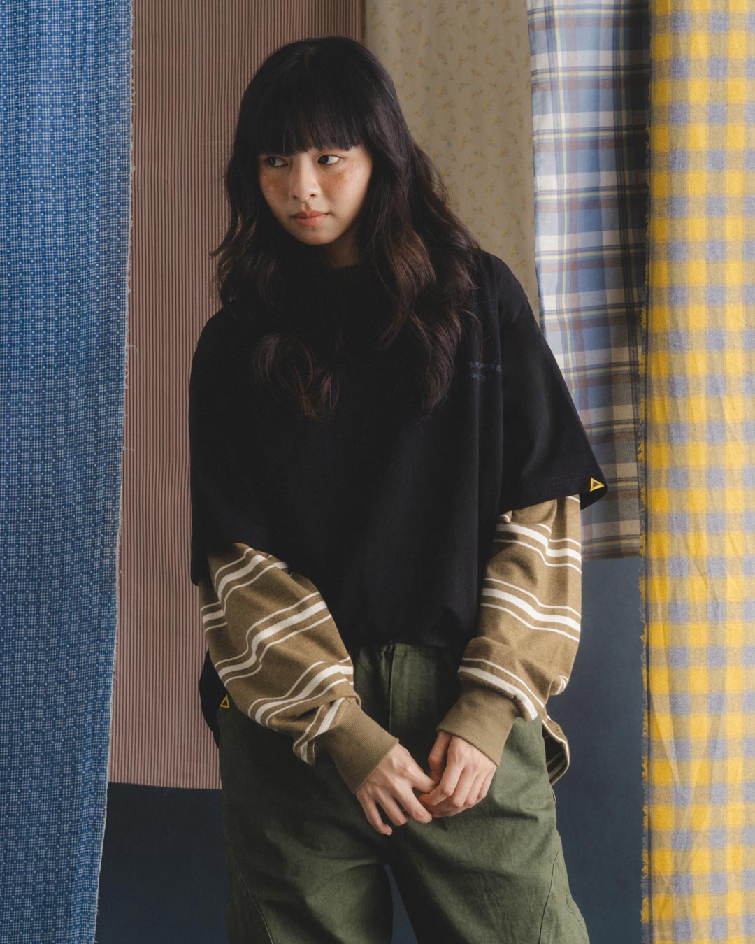 A Eckhaus Latta Shirt pictured on a model in front of a white background. The title of the product is Eckhaus Latta Eclipse Turtleneck - Stone and the image was taken by 199A®.