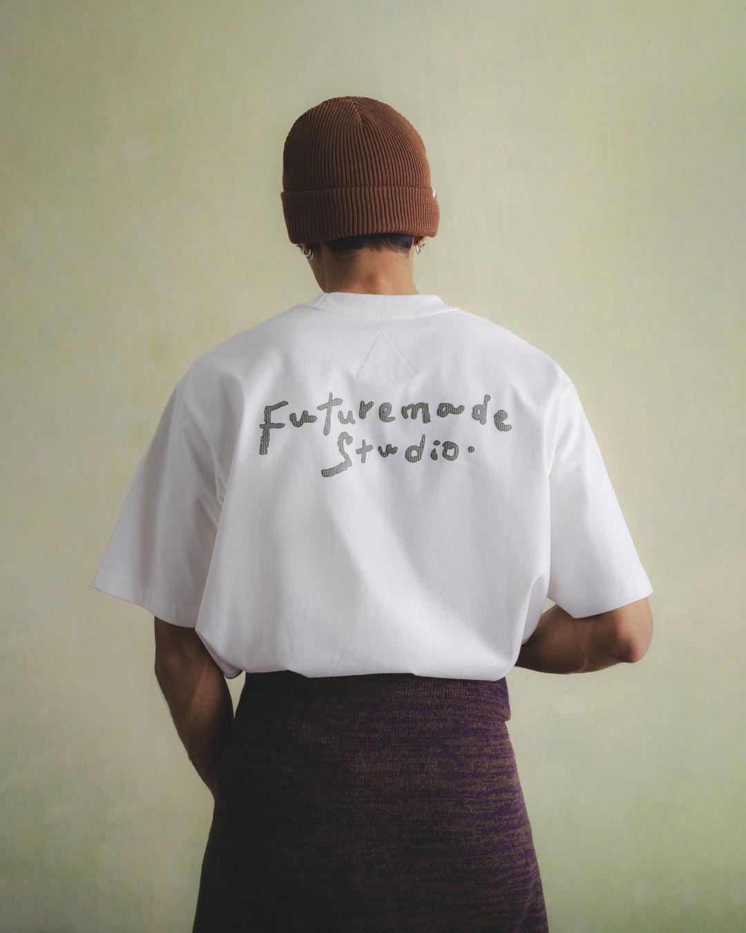 A Eckhaus Latta Shirt pictured on a model in front of a white background. The title of the product is Eckhaus Latta Eclipse Turtleneck - Stone and the image was taken by 199A®.