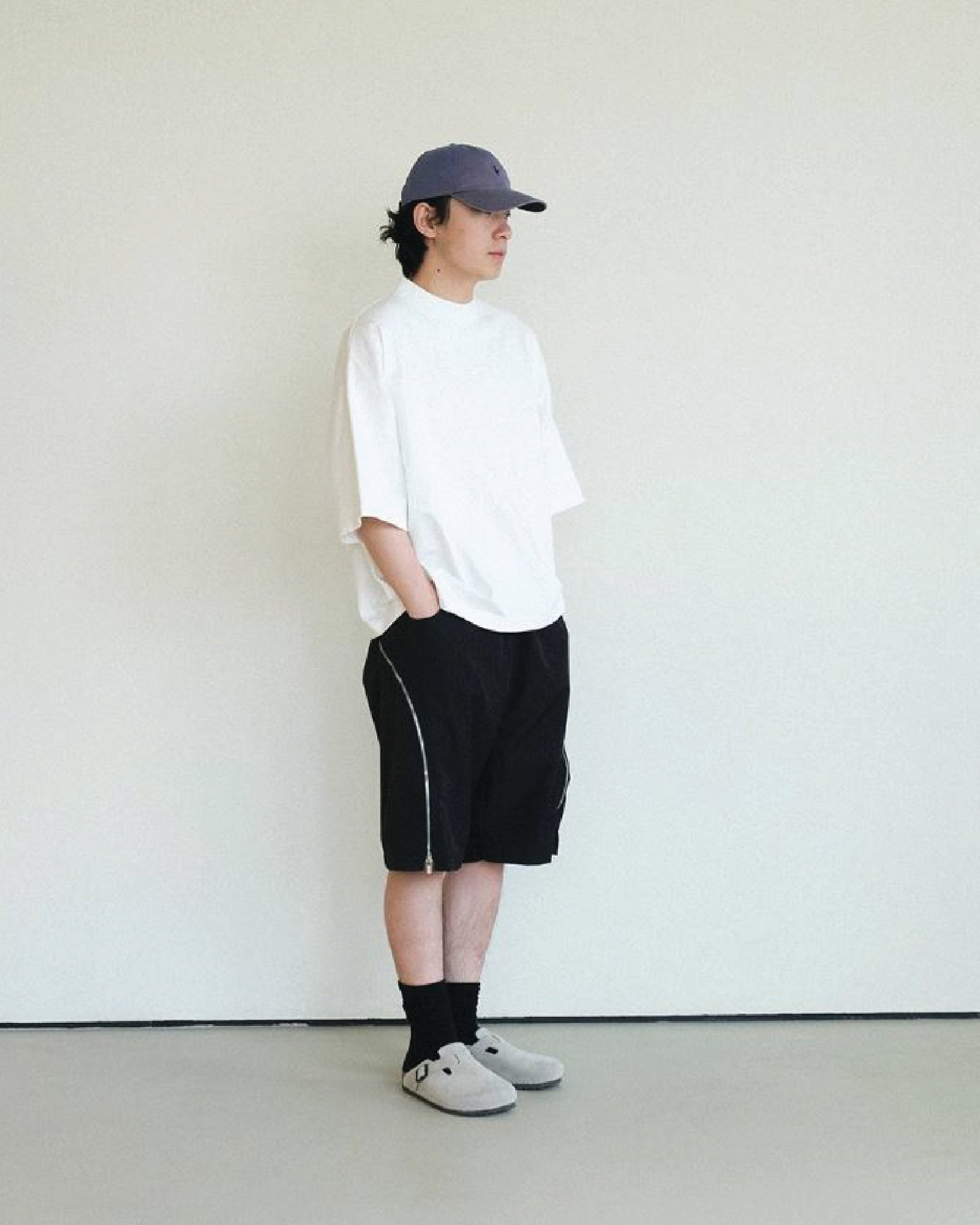 A Eckhaus Latta Shirt pictured on a model in front of a white background. The title of the product is Eckhaus Latta Eclipse Turtleneck - Stone and the image was taken by 199A®.