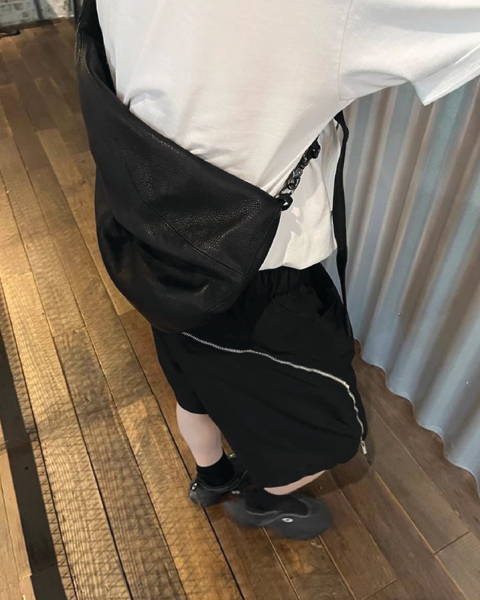 A Eckhaus Latta Shirt pictured on a model in front of a white background. The title of the product is Eckhaus Latta Eclipse Turtleneck - Stone and the image was taken by 199A®.