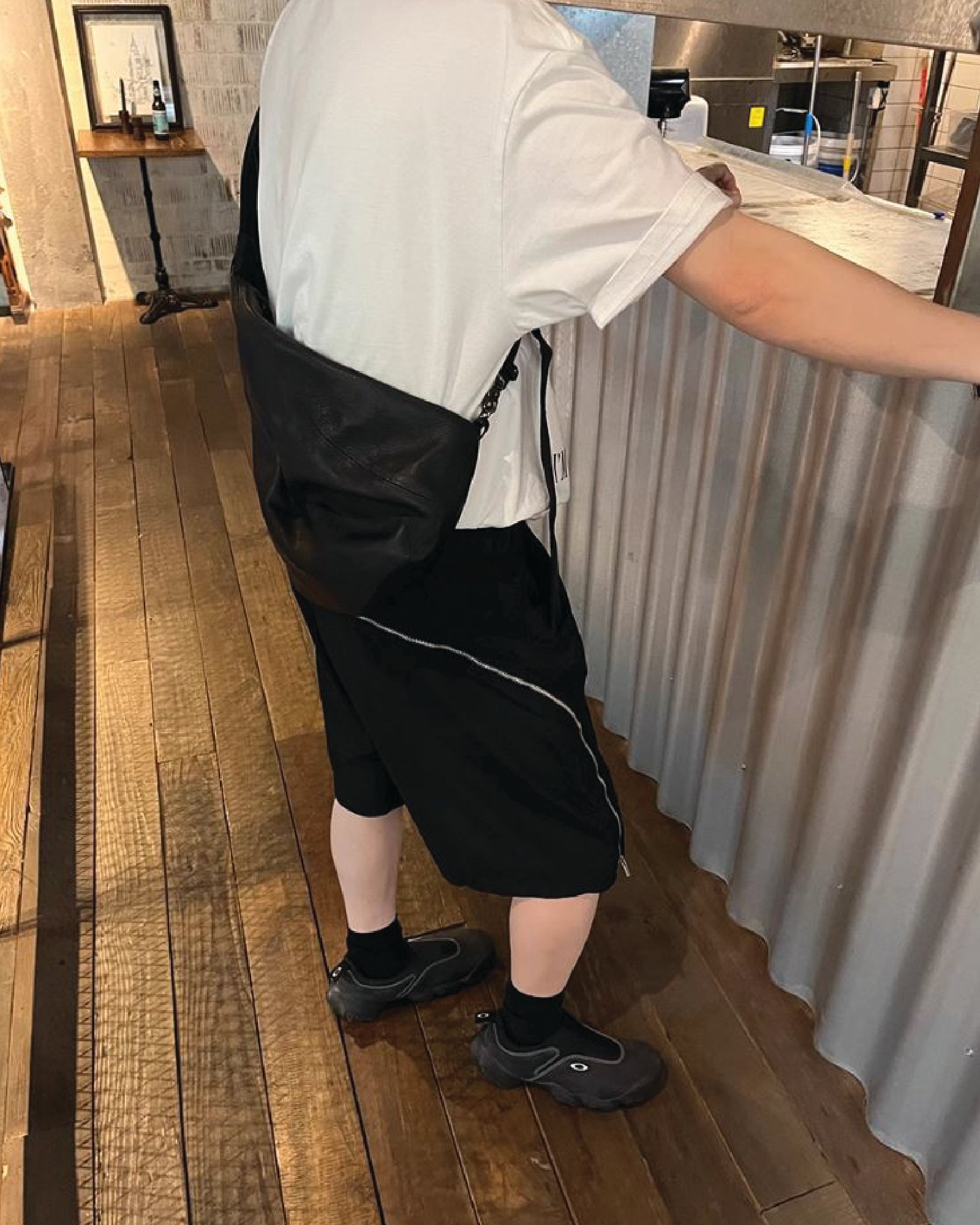 A Eckhaus Latta Shirt pictured on a model in front of a white background. The title of the product is Eckhaus Latta Eclipse Turtleneck - Stone and the image was taken by 199A®.