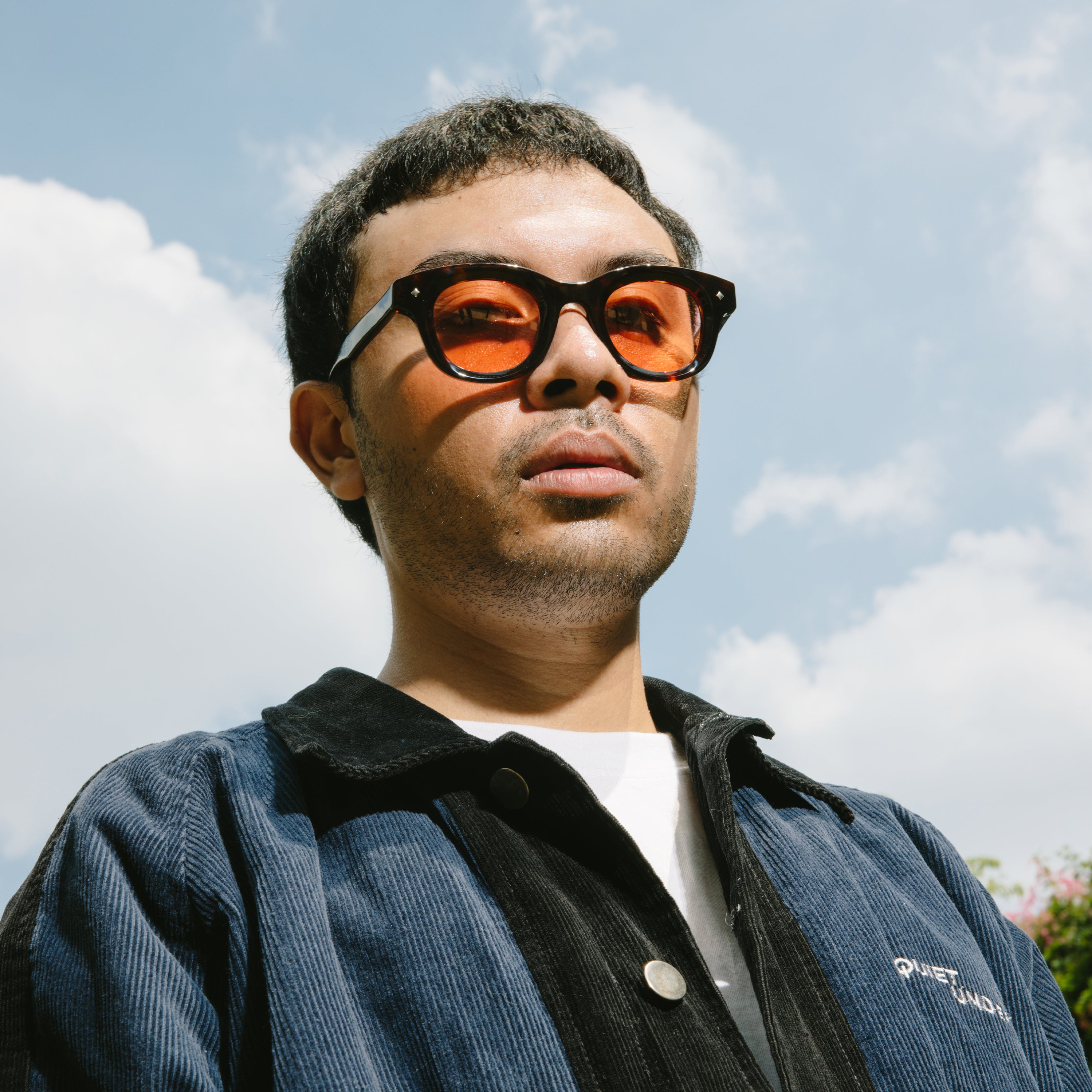 A Eckhaus Latta Shirt pictured on a model in front of a white background. The title of the product is Eckhaus Latta Eclipse Turtleneck - Stone and the image was taken by 199A®.