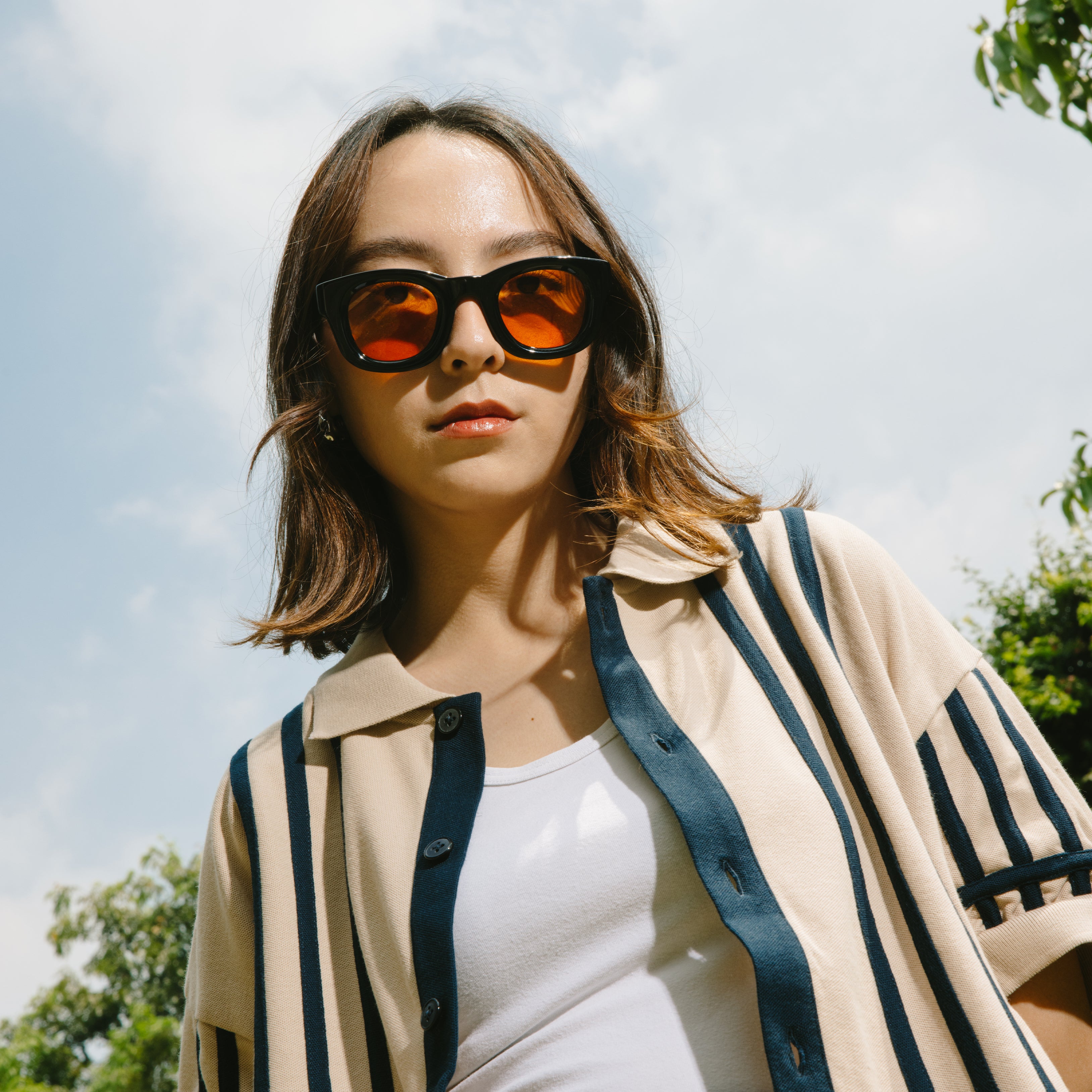 A Eckhaus Latta Shirt pictured on a model in front of a white background. The title of the product is Eckhaus Latta Eclipse Turtleneck - Stone and the image was taken by 199A®.
