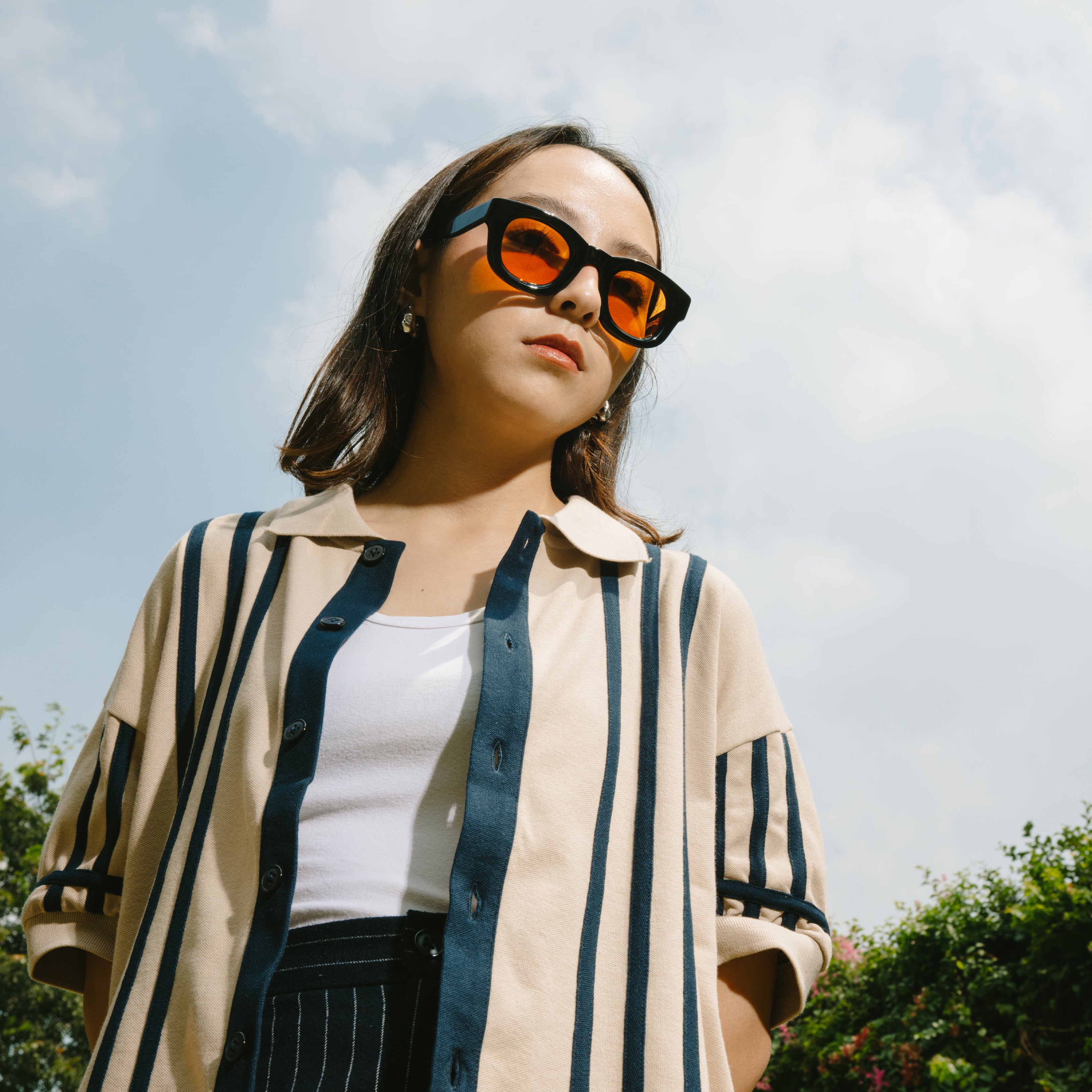 A Eckhaus Latta Shirt pictured on a model in front of a white background. The title of the product is Eckhaus Latta Eclipse Turtleneck - Stone and the image was taken by 199A®.