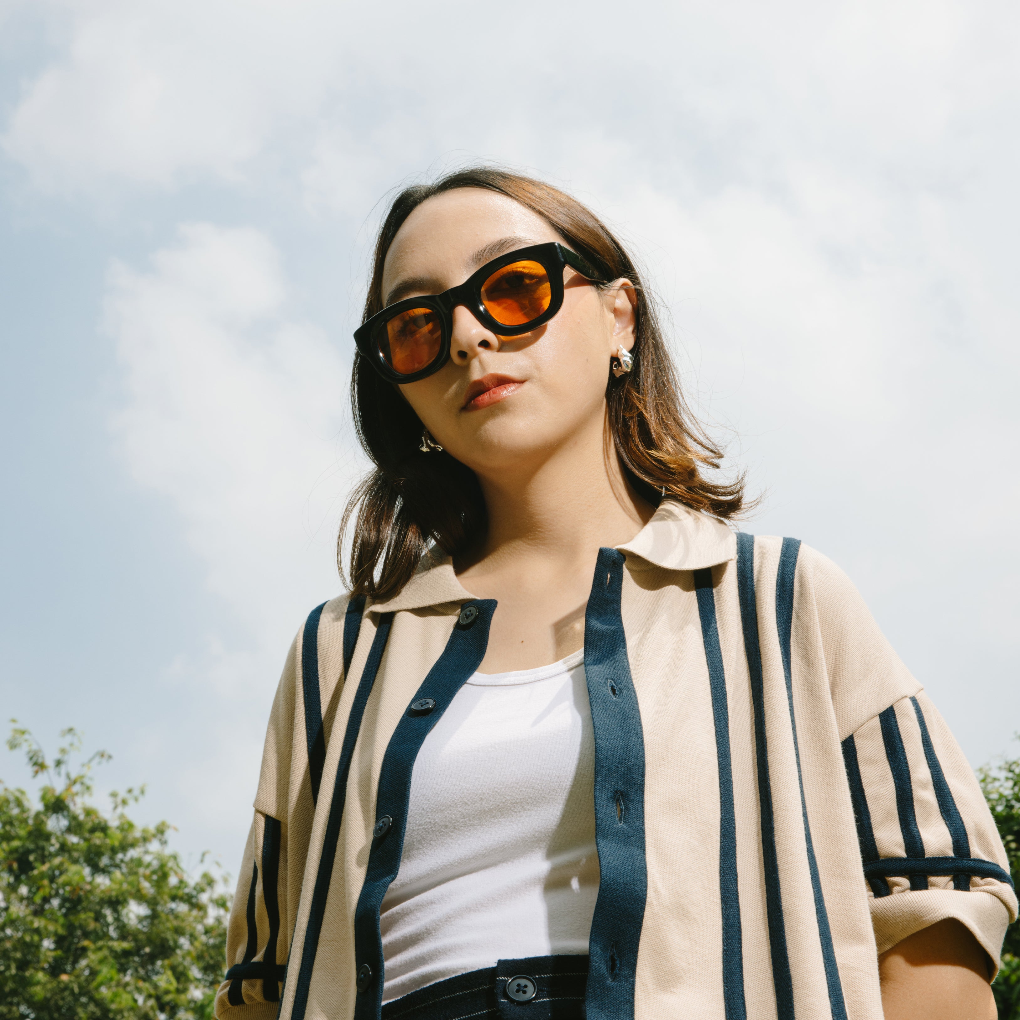 A Eckhaus Latta Shirt pictured on a model in front of a white background. The title of the product is Eckhaus Latta Eclipse Turtleneck - Stone and the image was taken by 199A®.