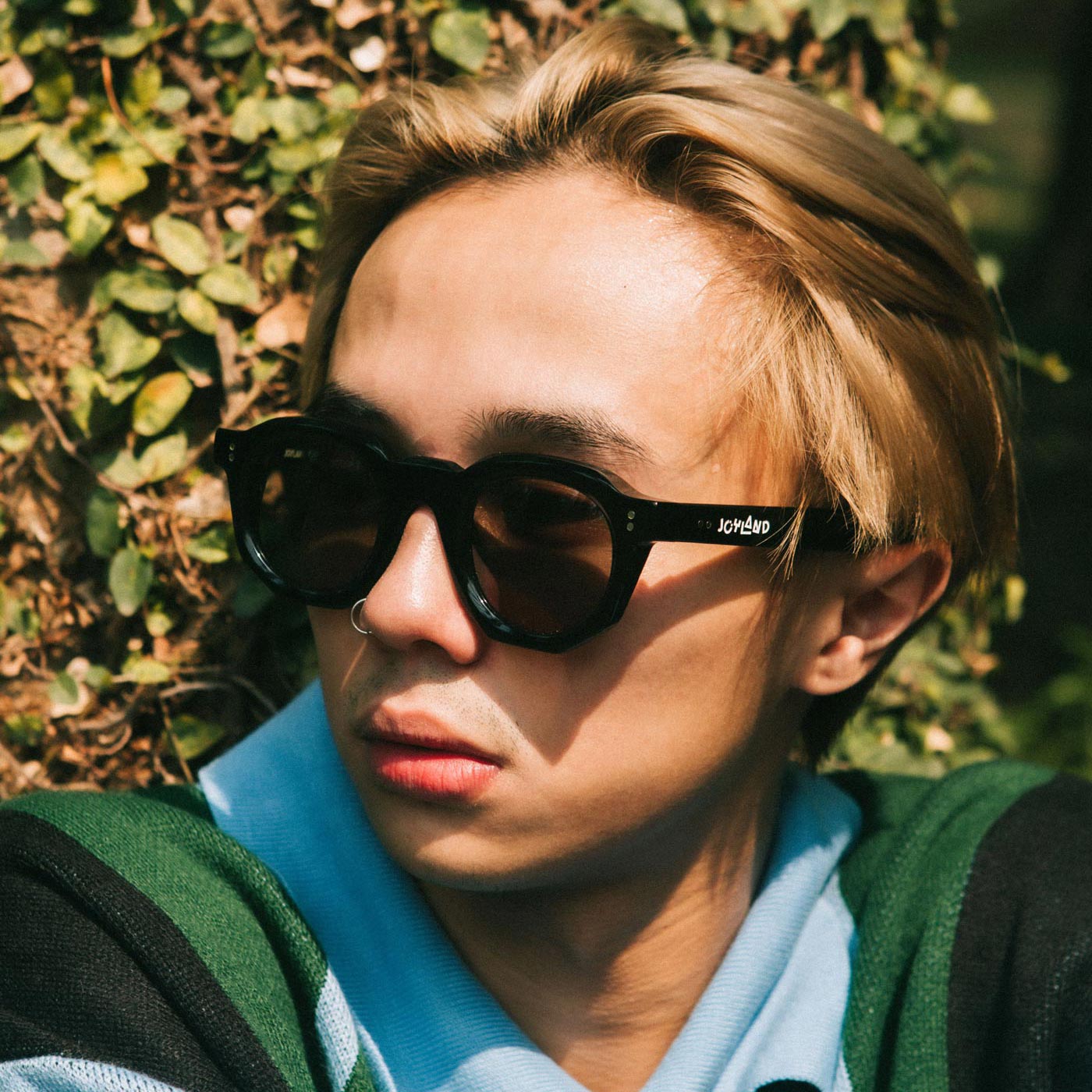 A Eckhaus Latta Shirt pictured on a model in front of a white background. The title of the product is Eckhaus Latta Eclipse Turtleneck - Stone and the image was taken by 199A®.