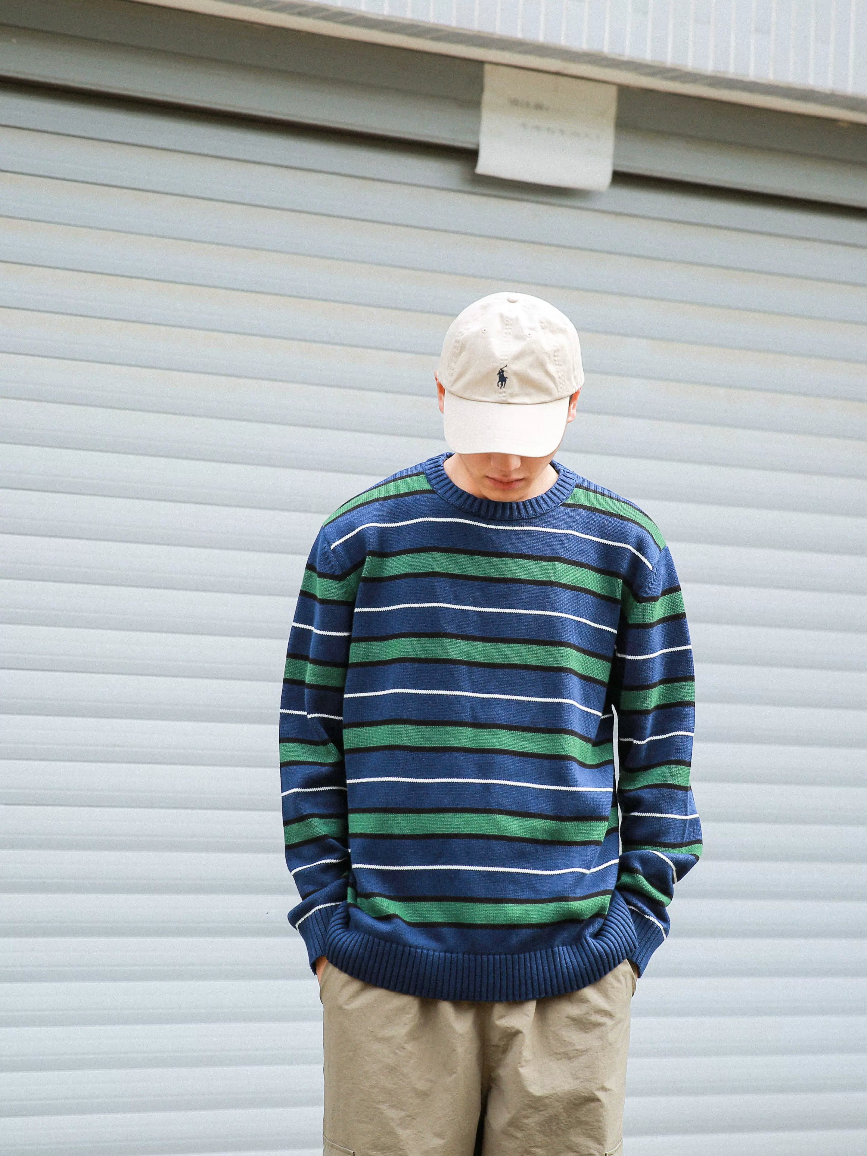 A Eckhaus Latta Shirt pictured on a model in front of a white background. The title of the product is Eckhaus Latta Eclipse Turtleneck - Stone and the image was taken by 199A®.