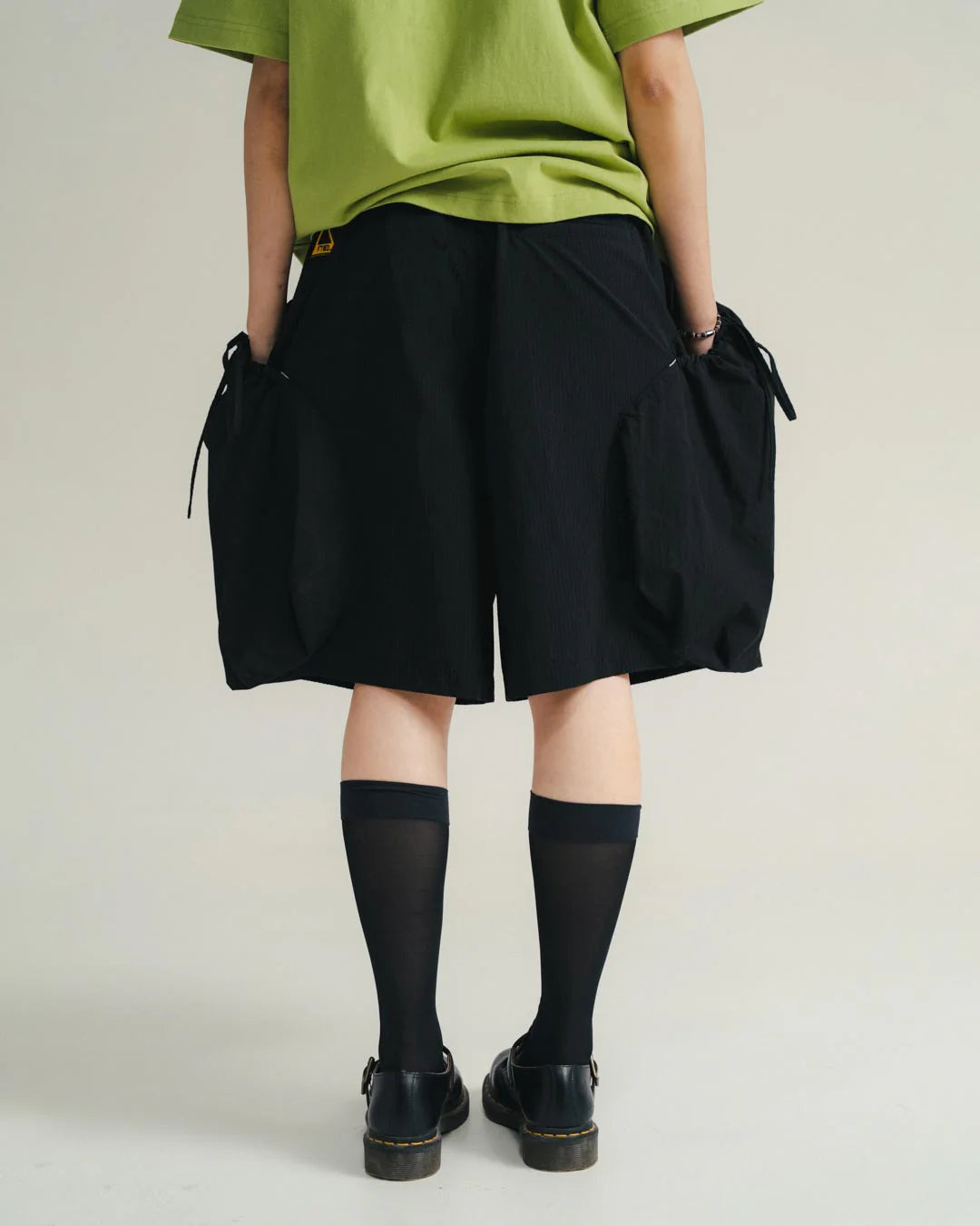 A Eckhaus Latta Shirt pictured on a model in front of a white background. The title of the product is Eckhaus Latta Eclipse Turtleneck - Stone and the image was taken by 199A®.