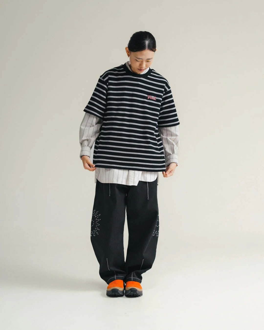 A Eckhaus Latta Shirt pictured on a model in front of a white background. The title of the product is Eckhaus Latta Eclipse Turtleneck - Stone and the image was taken by 199A®.