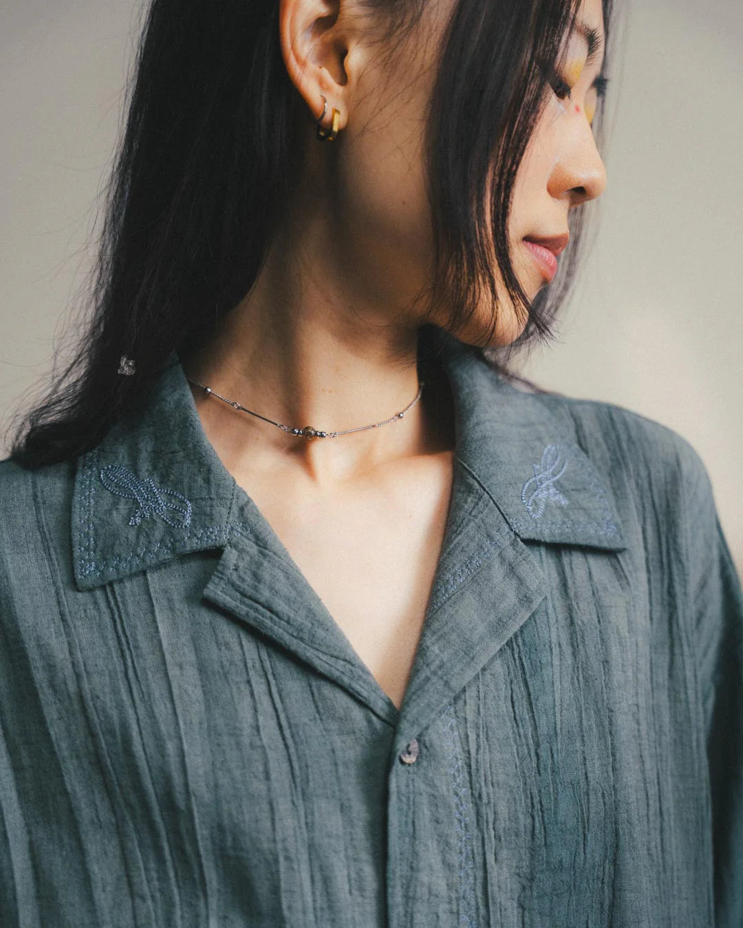 A Eckhaus Latta Shirt pictured on a model in front of a white background. The title of the product is Eckhaus Latta Eclipse Turtleneck - Stone and the image was taken by 199A®.