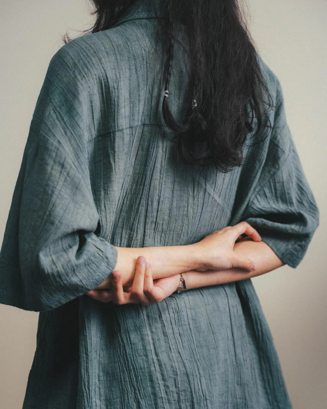 A Eckhaus Latta Shirt pictured on a model in front of a white background. The title of the product is Eckhaus Latta Eclipse Turtleneck - Stone and the image was taken by 199A®.
