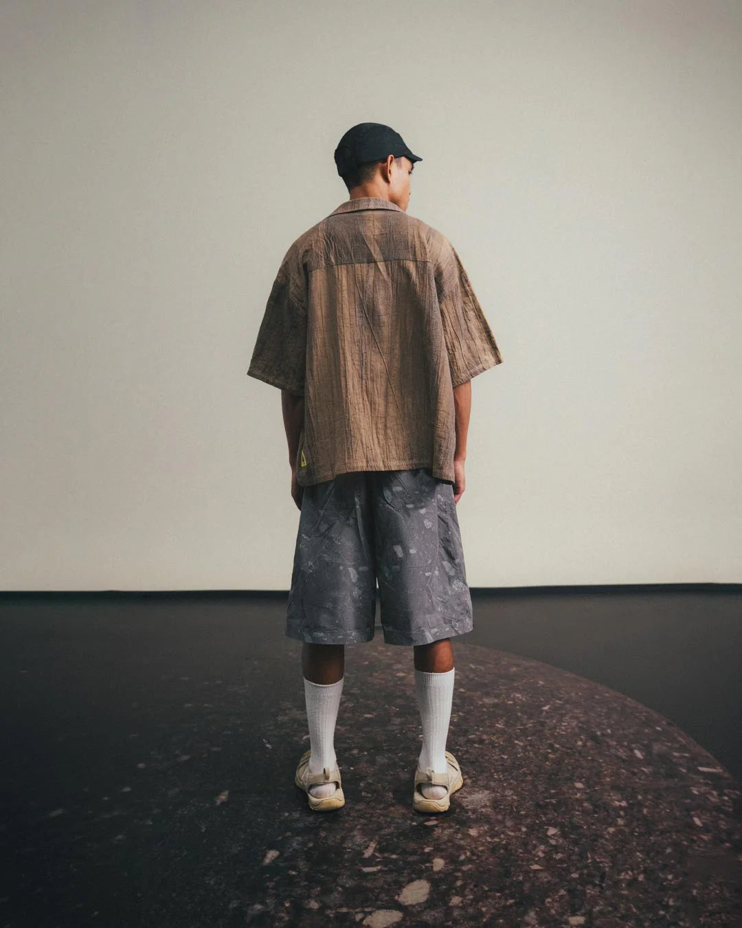 A Eckhaus Latta Shirt pictured on a model in front of a white background. The title of the product is Eckhaus Latta Eclipse Turtleneck - Stone and the image was taken by 199A®.