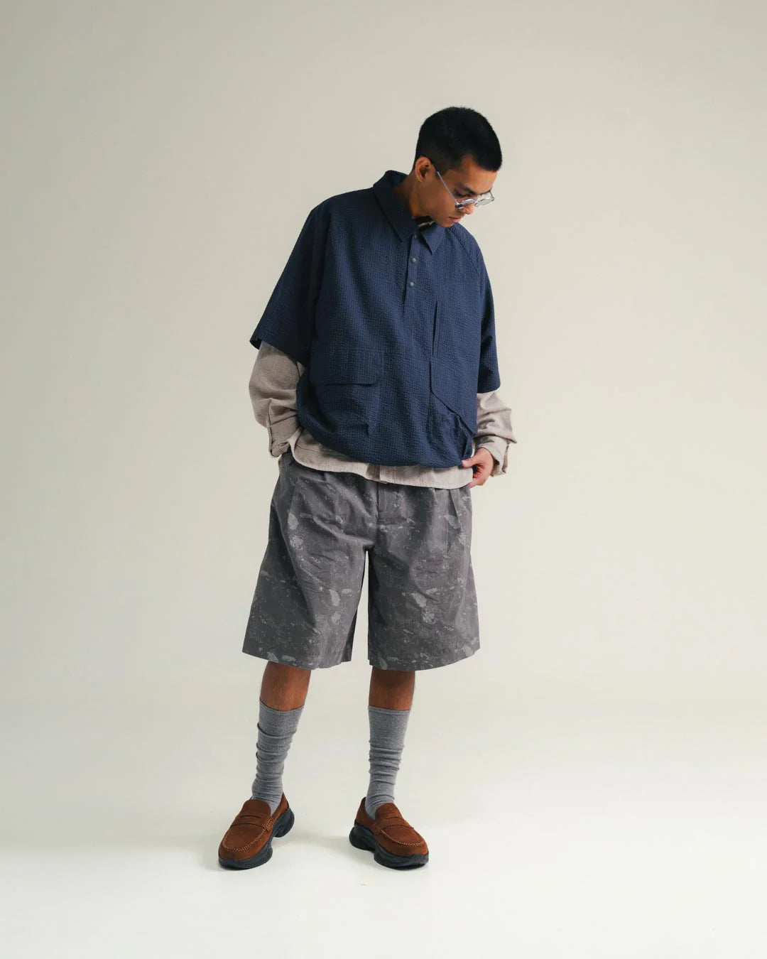 A Eckhaus Latta Shirt pictured on a model in front of a white background. The title of the product is Eckhaus Latta Eclipse Turtleneck - Stone and the image was taken by 199A®.