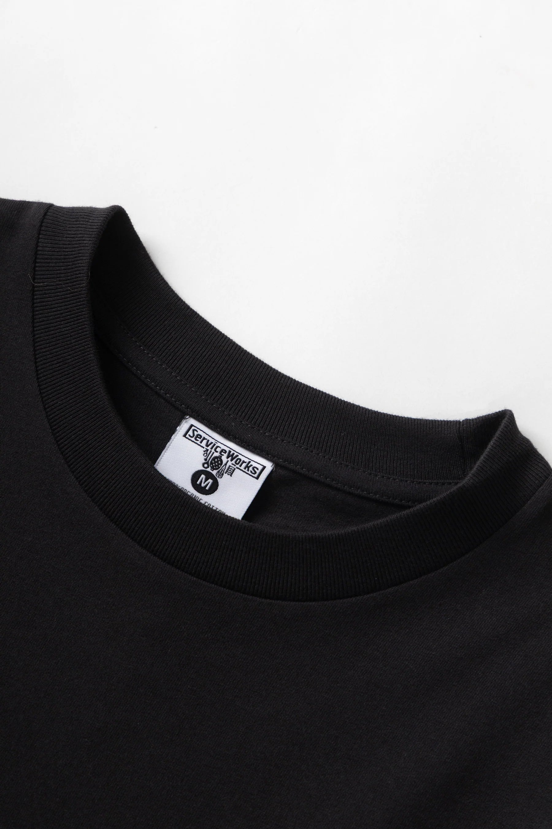 A Eckhaus Latta Shirt pictured on a model in front of a white background. The title of the product is Eckhaus Latta Eclipse Turtleneck - Stone and the image was taken by 199A®.