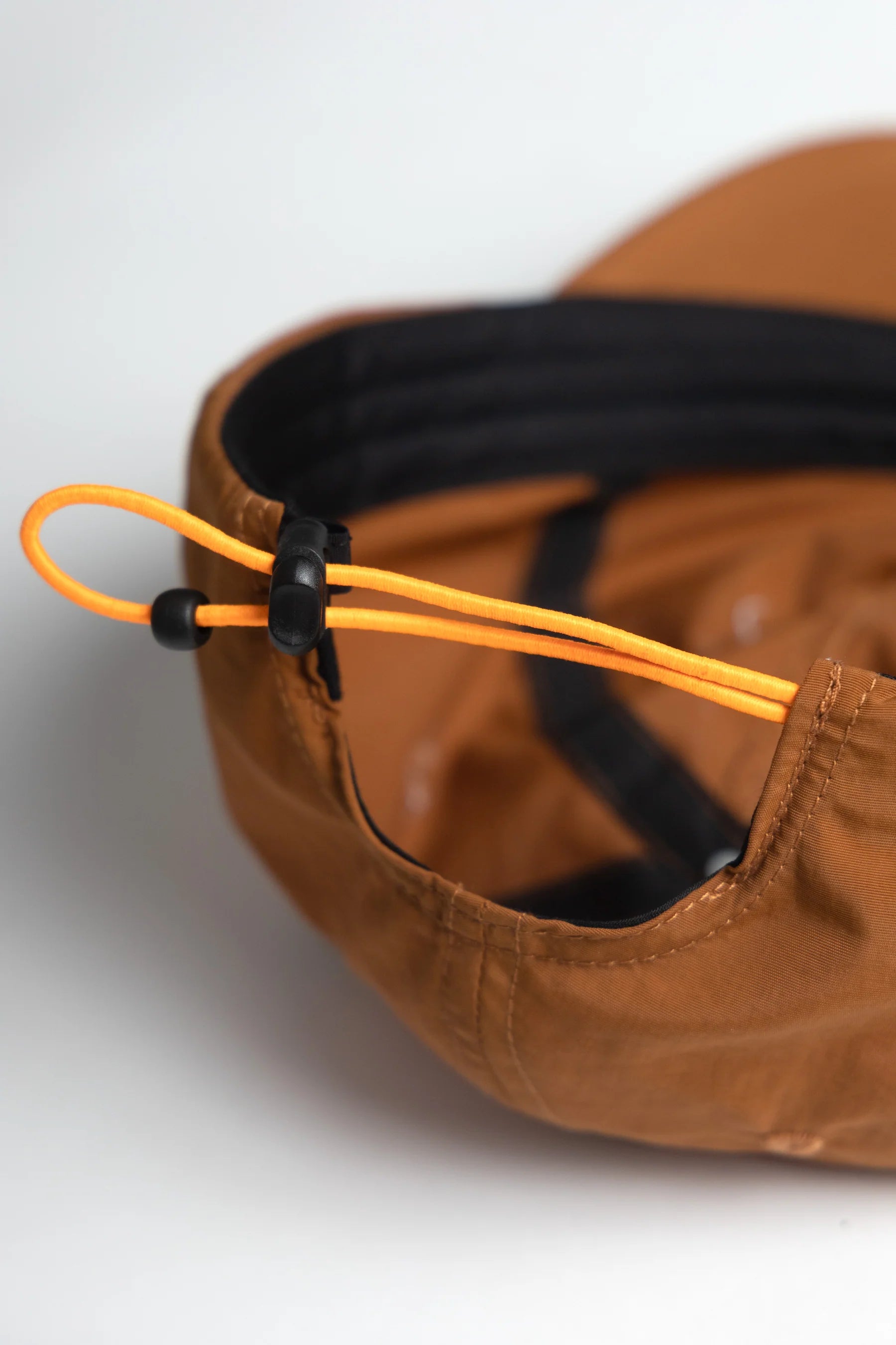 A Eckhaus Latta Shirt pictured on a model in front of a white background. The title of the product is Eckhaus Latta Eclipse Turtleneck - Stone and the image was taken by 199A®.