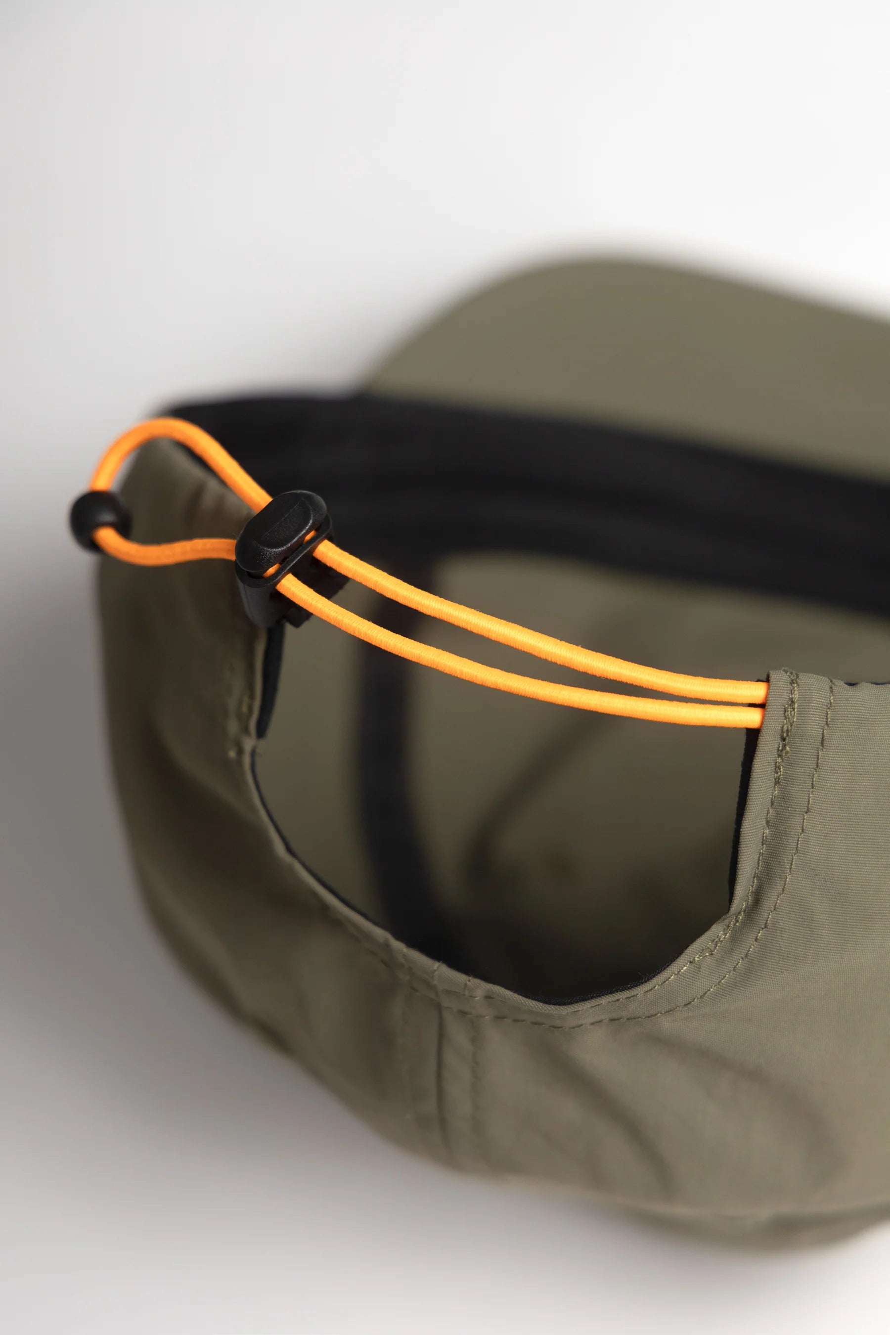 A Eckhaus Latta Shirt pictured on a model in front of a white background. The title of the product is Eckhaus Latta Eclipse Turtleneck - Stone and the image was taken by 199A®.