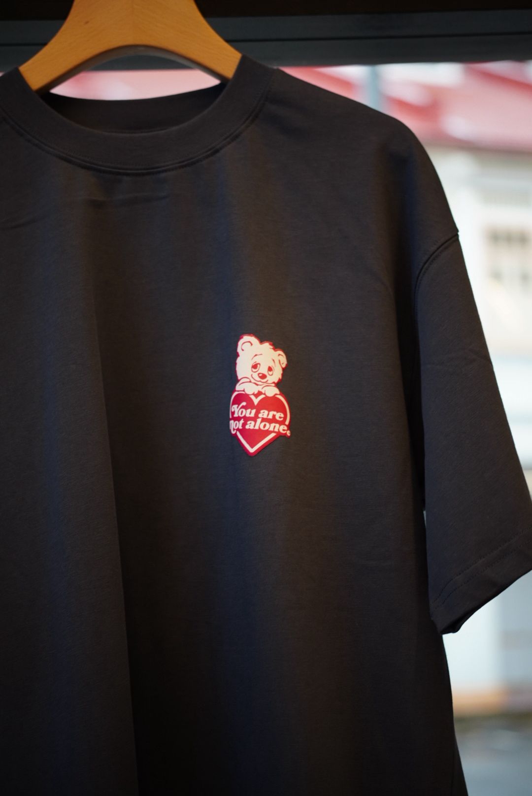 A Eckhaus Latta Shirt pictured on a model in front of a white background. The title of the product is Eckhaus Latta Eclipse Turtleneck - Stone and the image was taken by 199A®.