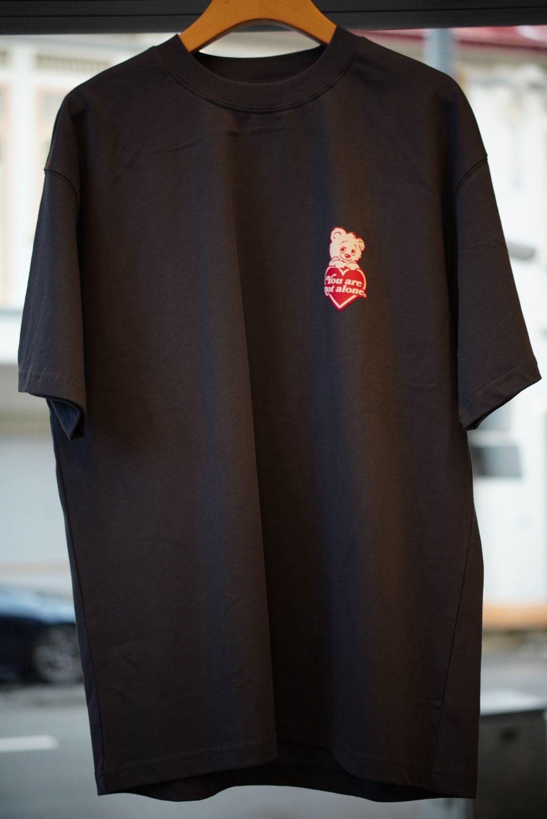 A Eckhaus Latta Shirt pictured on a model in front of a white background. The title of the product is Eckhaus Latta Eclipse Turtleneck - Stone and the image was taken by 199A®.